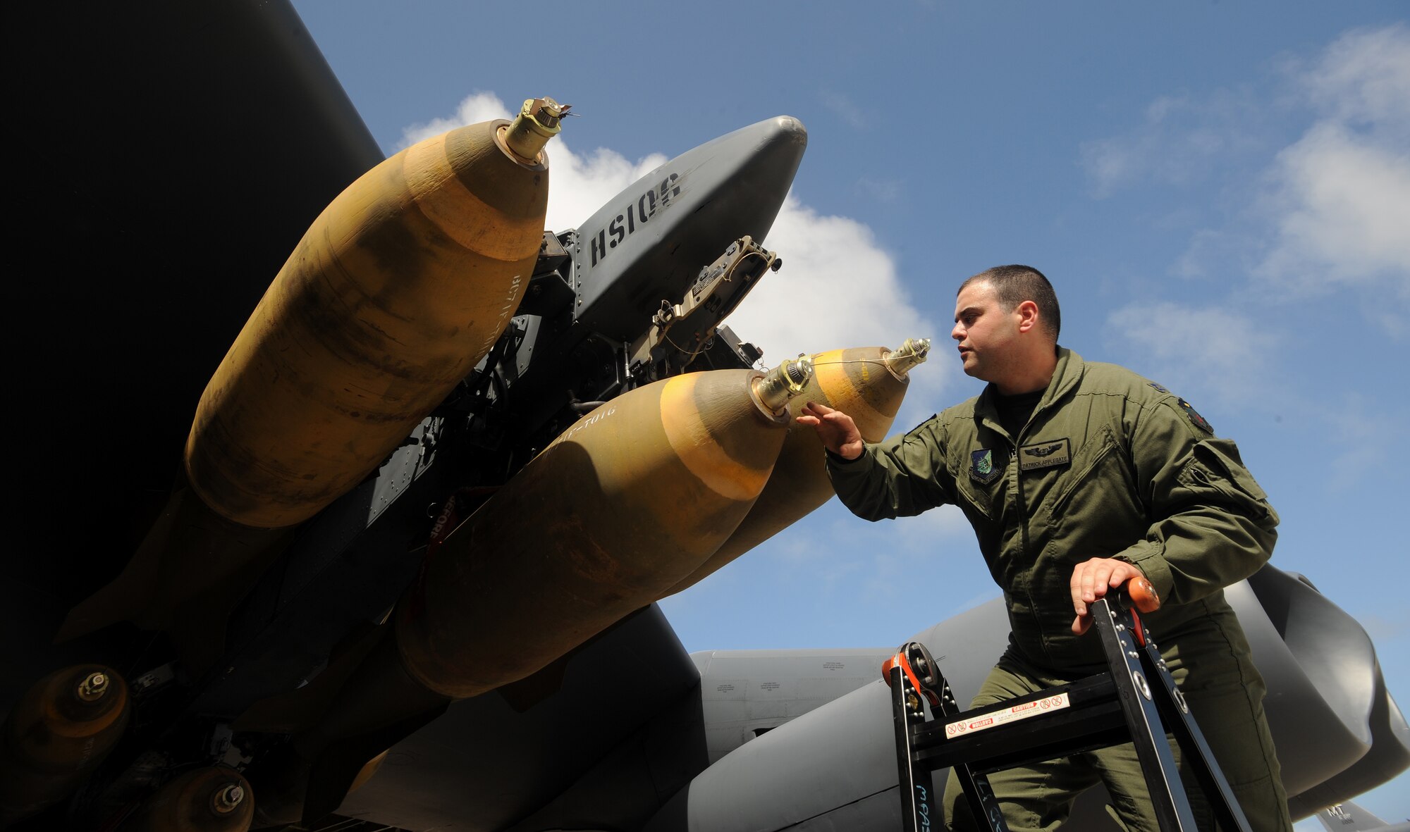 ANDERSEN AIR FORCE BASE, Guam -- Capt. Patrick Applegate, 23rd Expeditionary Bomb Squadron, removes ground safety pins on a MAU-12 Jan. 29, prior to a B-52 Stratofortress live drop mission for exercise Tropic Fury over the Farallon de Medinilla Target Range. The B-52 dropped live M-117 ordnance during the exercise. Tropic Fury was developed to train aircrew on the use of conventional air launched crew missiles and joint air-to-surface standoff missile conventional weapon systems. The B-52 is deployed from Minot AFB, N.D., to Andersen AFB, Guam, with the 23rd Expeditionary Bomb Squadron. Training missions such as this one ensure the maintenance and aircrew both perform real world tactics and defensive measures by loading and dropping live weapons on target. The bomber's participation in constant training helps emphasize the U.S. bomber presence, demonstrating U.S. commitment to the Pacific region. (U.S. Air Force photo by Master Sgt. Kevin J. Gruenwald)   