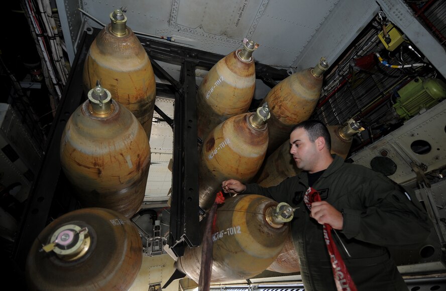 ANDERSEN AIR FORCE BASE, Guam -- Capt. Patrick Applegate, 23rd Expeditionary Bomb Squadron, removes ground safety pins on a MAU-12 Jan. 29, prior to a B-52 Stratofortress live drop mission for exercise Tropic Fury over the Farallon de Medinilla Target Range. The B-52 dropped live M-117 ordnance during the exercise. Tropic Fury was developed to train aircrew on the use of conventional air launched crew missiles and joint air-to-surface standoff missile conventional weapon systems. The B-52 is deployed from Minot AFB, N.D., to Andersen AFB, Guam, with the 23rd Expeditionary Bomb Squadron. Training missions such as this one ensure the maintenance and aircrew both perform real world tactics and defensive measures by loading and dropping live weapons on target. The bomber's participation in constant training helps emphasize the U.S. bomber presence, demonstrating U.S. commitment to the Pacific region.  (U.S. Air Force photo by Master Sgt. Kevin J. Gruenwald) 
