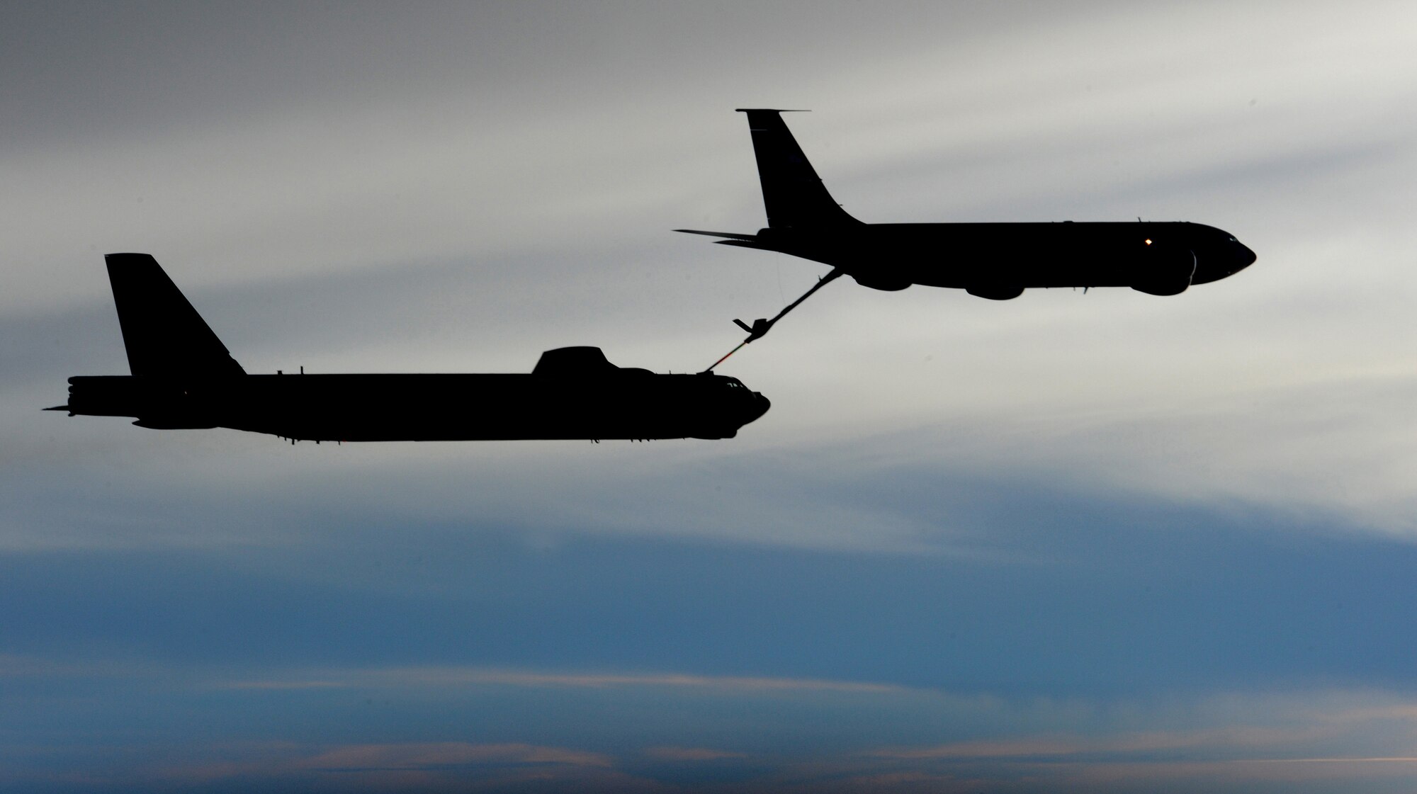 ANDERSEN AIR FORCE BASE, Guam -- A KC-135 Stratotanker refuels a B-52 Stratofortress from Minot AFB, N.D., over the Pacific Ocean Jan. 22 during exercise Tropic Fury. The exercise was developed to train aircrew on the use of conventional air launched crew missiles and joint air to surface standoff missile conventional weapon systems. The B-52 is deployed to Andersen AFB, Guam, with the 23rd Expeditionary Bomb Squadron and is part of a continous bomber presence in the region. The KC-135 is deployed to Andersen from 434th Air Refueling Wing, Grissom Air Reserve Base, Ind., supporting Pacific theater refueling operations. (U.S. Air Force photo by Master Sgt. Kevin J. Gruenwald)