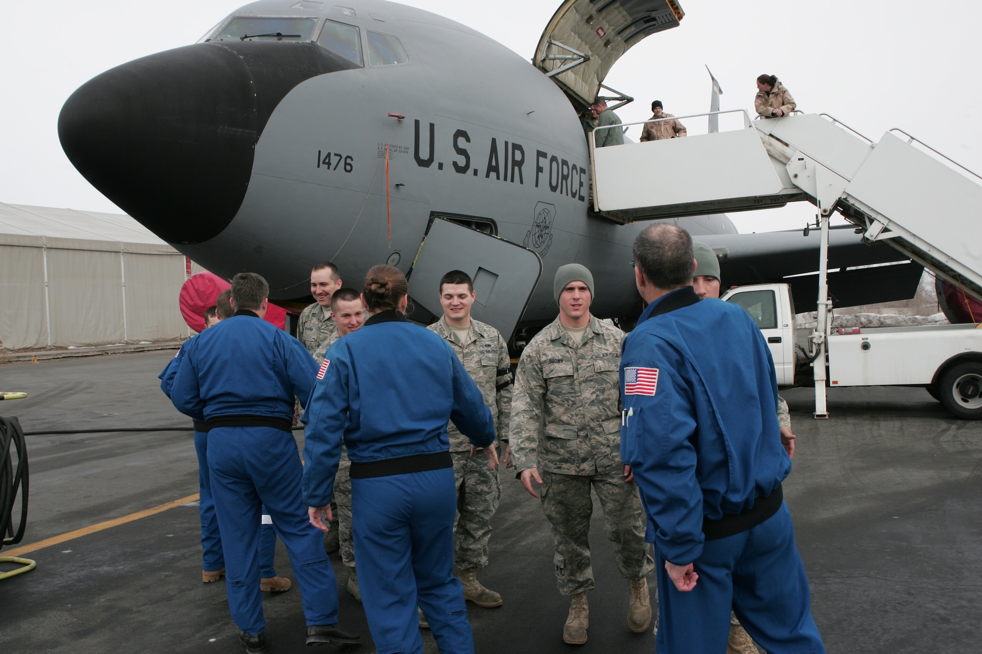 The crew of NASA's Space Shuttle Endeavour STS-126 mission greet KC-135 Stratotanker maintainers of the 376th Expeditionary Aircraft Maintenance Squadron during a tour of Manas Air Base, Kyrgyzstan, Jan. 28. The visit marked the first time NASA astronauts have toured the deployed area of operations after a mission and was the first time astronauts have visited Manas AB and the country of Kyrgyzstan. Manas AB serves as the premier air mobility hub supporting operations in Afghanistan. (U.S. Air Force photo/Tech. Sgt. David Jones) 