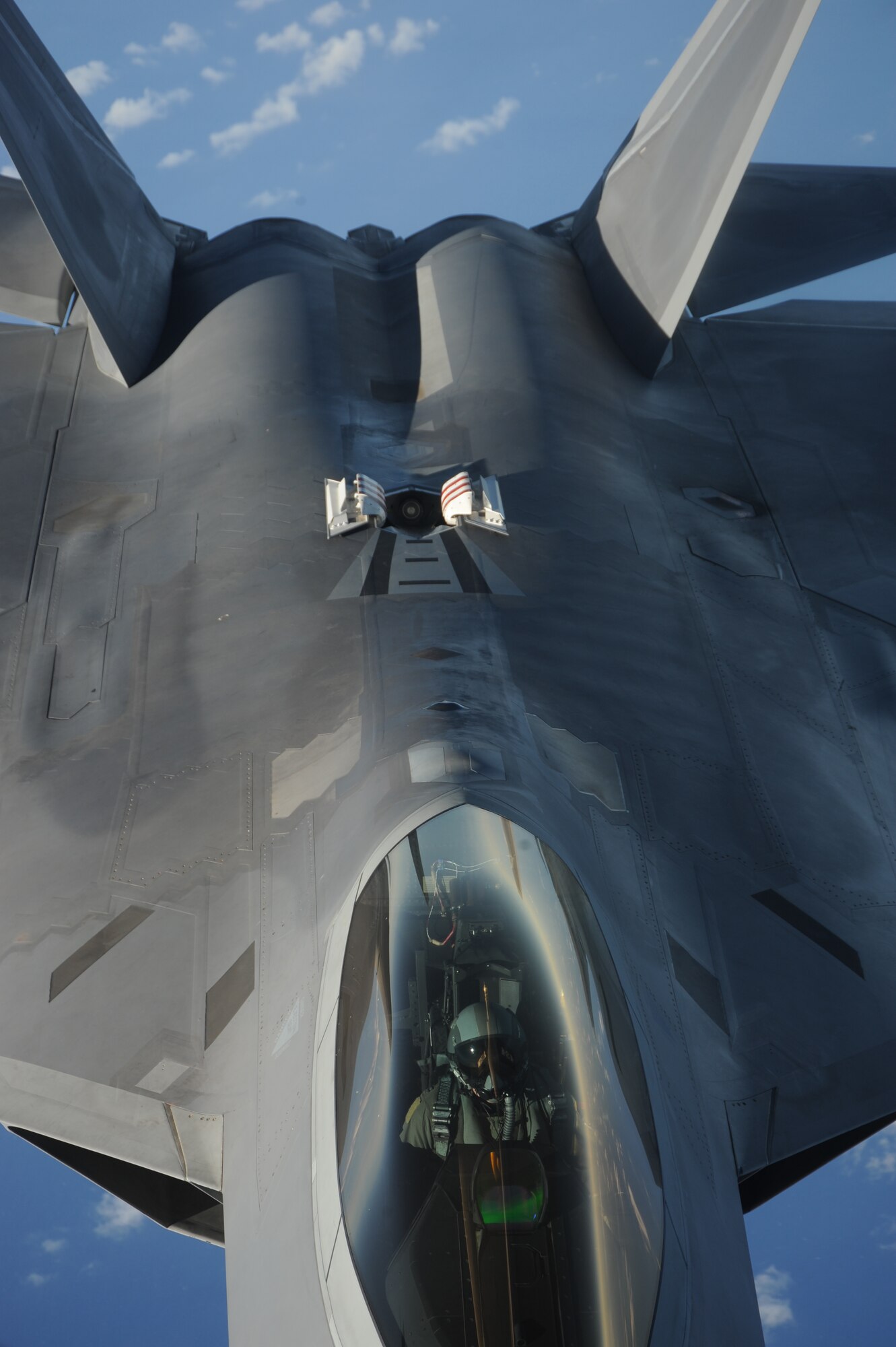 An F-22 Raptor moves into position to receive fuel from a KC-135 Stratotanker over the Pacific Ocean Jan. 28 The Raptors are deployed from Elmendorf Air Force Base, Alaska to the 90th Expeditionary Fighter Squadron Andersen Air Force Base, Guam. The stealth-fighters, along with associated maintenance and support personnel will participate in various exercises that provide routine training in an environment different from their home station. The F-22 is a highly maneuverable combat aircraft that can avoid enemy detection, cruise at supersonic speeds, and provide the joint force commander an unprecedented level of integrated situational awareness.(U.S. Air Force photo/ Master Sgt. Kevin J. Gruenwald) released 