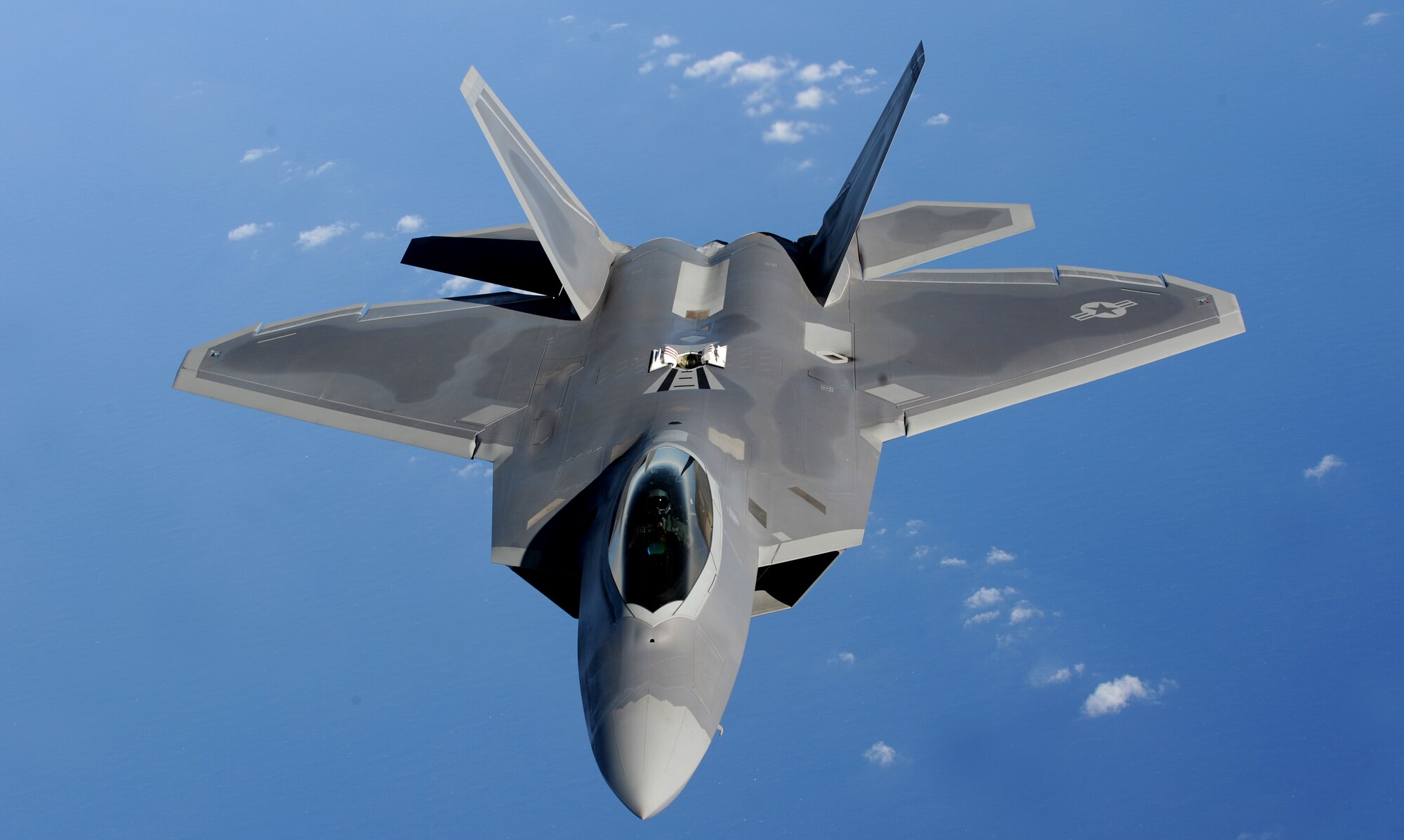 ANDERSEN AIR FORCE BASE, Guam - An F-22 Raptor moves into position to receive fuel from a KC-135 Stratotanker over the Pacific Ocean Jan. 28 The Raptors are deployed from Elmendorf AFB, Alaska, to the 90th Expeditionary Fighter Squadron at Andersen AFB, Guam. The stealth-fighters, along with associated maintenance and support personnel will participate in various exercises that provide routine training in an environment different from their home station. The F-22 is a highly maneuverable combat aircraft that can avoid enemy detection, cruise at supersonic speeds, and provide the joint force commander an unprecedented level of integrated situational awareness. (U.S. Air Force photo by Master Sgt. Kevin J. Gruenwald) 




















  












 











































  












 

























