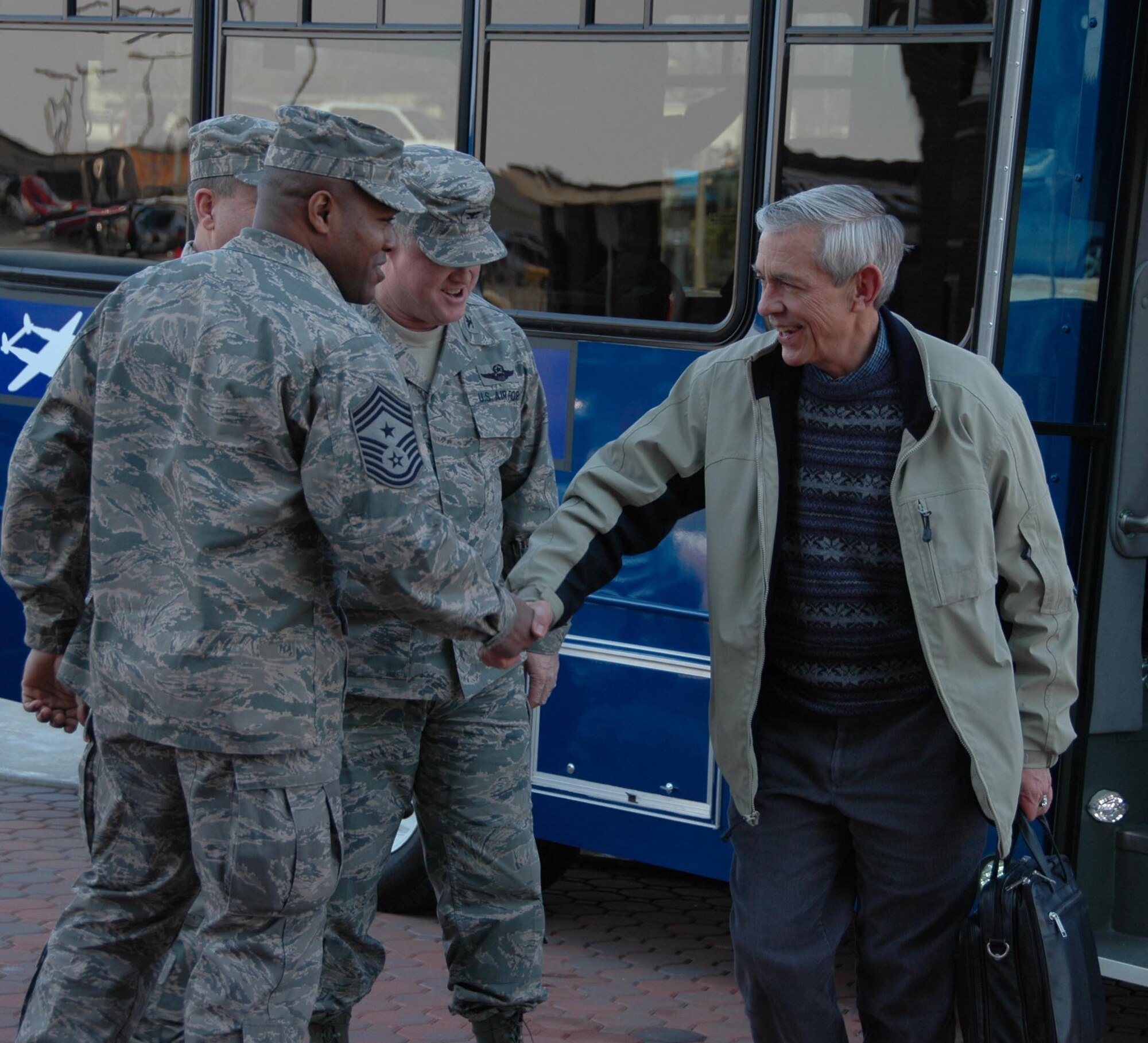 MCGUIRE AIR FORCE BASE, N.J. -- Mr. Craig W. Duehring, Assistant Secretary of the Air Force for Manpower and Reserve Affairs, right, greets top leadership from the 514th Air Mobility Wing and 108th Air National Guard during a recent visit to McGuire Air Force Base, N.J. During his stopover Secretary Duehring led a townhall session, answering questions from Guard and Reserve members, on several mission and personnel topics. (U.S. Air Force photo/Master Sgt. Donna T. Jeffries) 