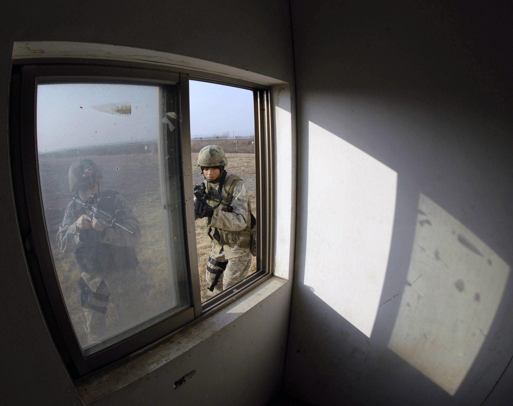 Airmen of the 51st Security Forces Squadron train on how to operate and survive in a war environment during the base's combat readiness course Jan. 22 at Osan Air Base, South Korea. (U.S. Air Force photo) 