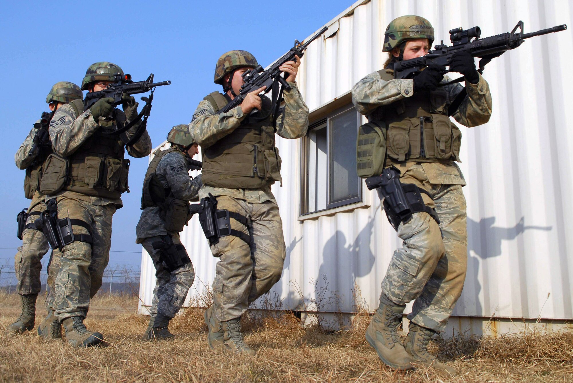 Airmen of the 51st Security Forces Squadron train on how to operate and survive in a war environment during the base's combat readiness course Jan. 22 at Osan Air Base, South Korea. (U.S. Air Force photo) 
