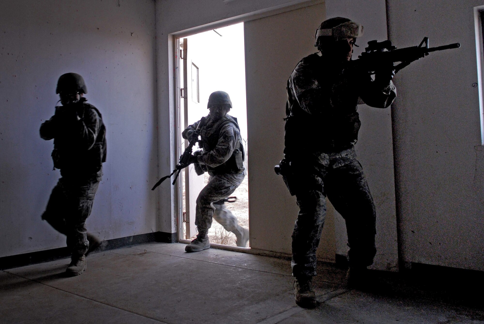 Airmen of the 51st Security Forces Squadron train on how to operate and survive in a war environment during the base's combat readiness course Jan. 22 at Osan Air Base, South Korea. (U.S. Air Force photo) 