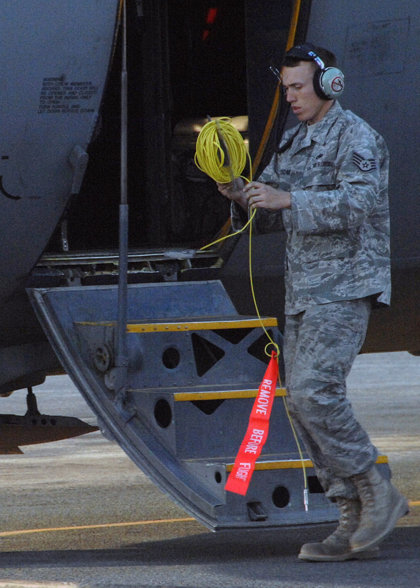 Staff Sgt. Brad Kretschmer, crew chief for C-130 Hercules no. 1847 at an air base in Southwest Asia, finishes his maintenance check after his C-130 completed its final combat mission Jan. 28.  After 47 years of service, the aircraft is being retired.  Sergeant Kretschmer has been the crew chief for this aircraft for the past three years, and will fly with the aircraft back to Germany. (U.S. Air Force photo/Senior Airman Courtney Richardson)