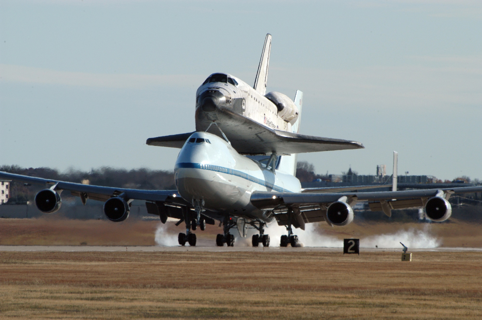 The Space shuttle Endeavour, atop a modified Boeing 747, lands at Naval Air Station Joint Reserve Base Fort Worth, Texas, for an overnight stay. The aircraft departed Edwards Air Force Base in California this morning, beginning a cross-country trek back to the spacecraft's homeport at Kennedy Space Center, Florida. (U.S. Navy photo by MC2(AW) D. Keith Simmons/Released)