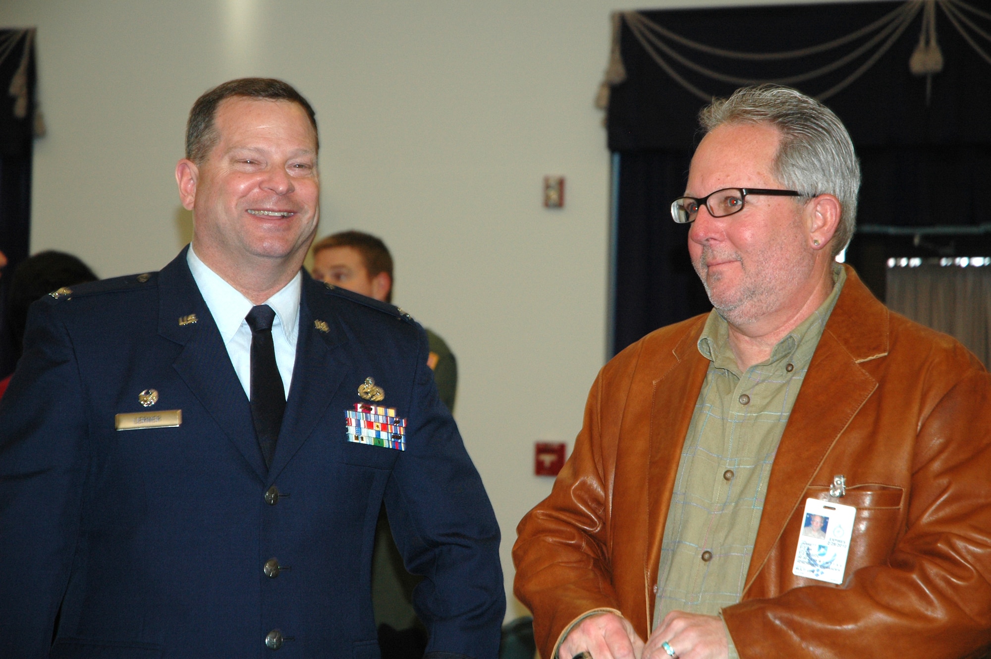 DOVER AIR FORCE BASE, Del. -- Col. Alan H. Lerner, 512th Maintenance Group commander, and Tom Jarrett, Cabinet Secretary for Delaware Department of Technology and Information and a former Verizon executive, speak after the honorary commander induction ceremony held at the Landings here Jan. 30. The honorary commander program aids in building relationships between military members and community leaders. The program at Dover Air Force Base began in 1992 and allows community leaders the opportunity to participate in many base functions over the course of their term. (U.S. Air Force photo/Senior Airman Andria J. Allmond)
