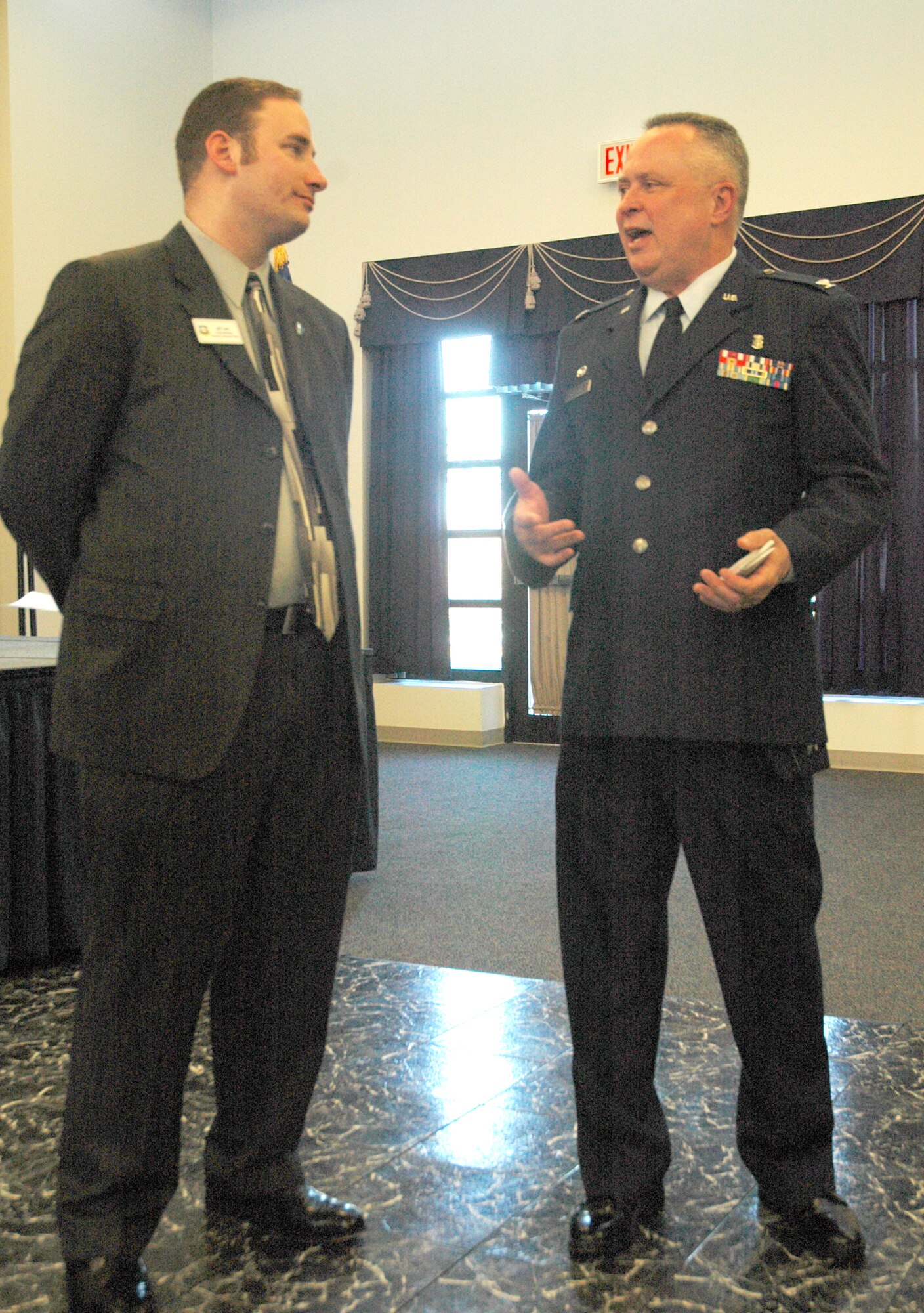 DOVER AIR FORCE BASE, Del. -- Col. Walton F. Reddish, 512th Aersopace Medicine Squadron commander, speaks with 512th Airlift Wing Honorary Commander Jeff Lank, Delaware Jaycees state president, after the honorary commander induction ceremony at the Landings here Jan. 30. The Liberty Wing honorary commanders serve a two-year term while the Eagle Wing's program is held annually. (U.S. Air Force photo/Senior Airman Andria J. Allmond) 