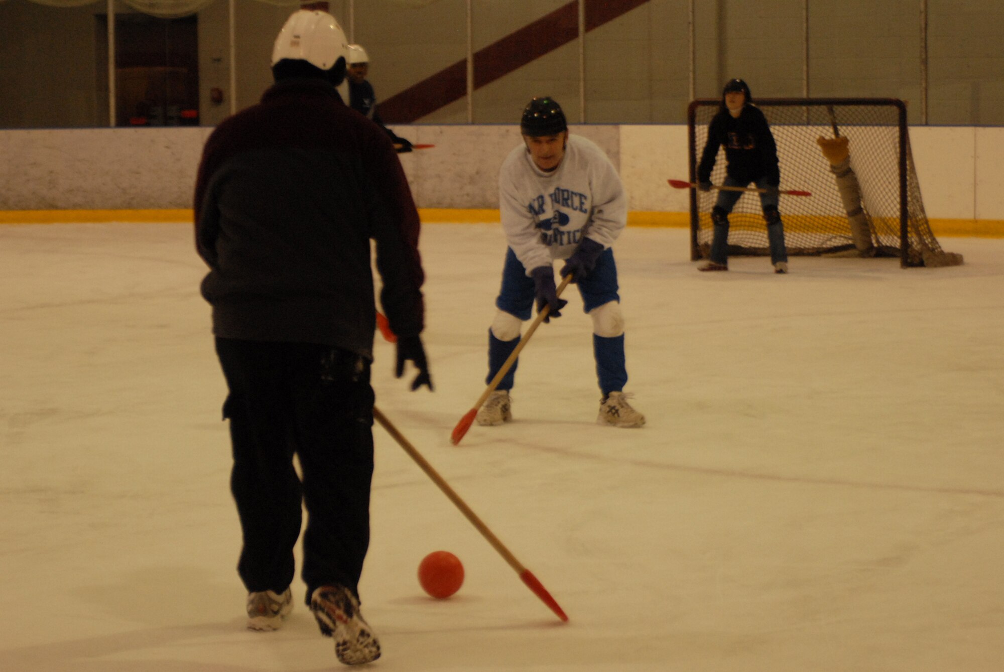 Col. John McDonald, 43rd Airlift Wing Commander, plays broomball with members of the 43rd Contracting Squadron Jan. 16 at Fort Bragg's Cleland Ice Rink. (U.S. Air Force Photo by 2nd Lt. Chris Hoyler)