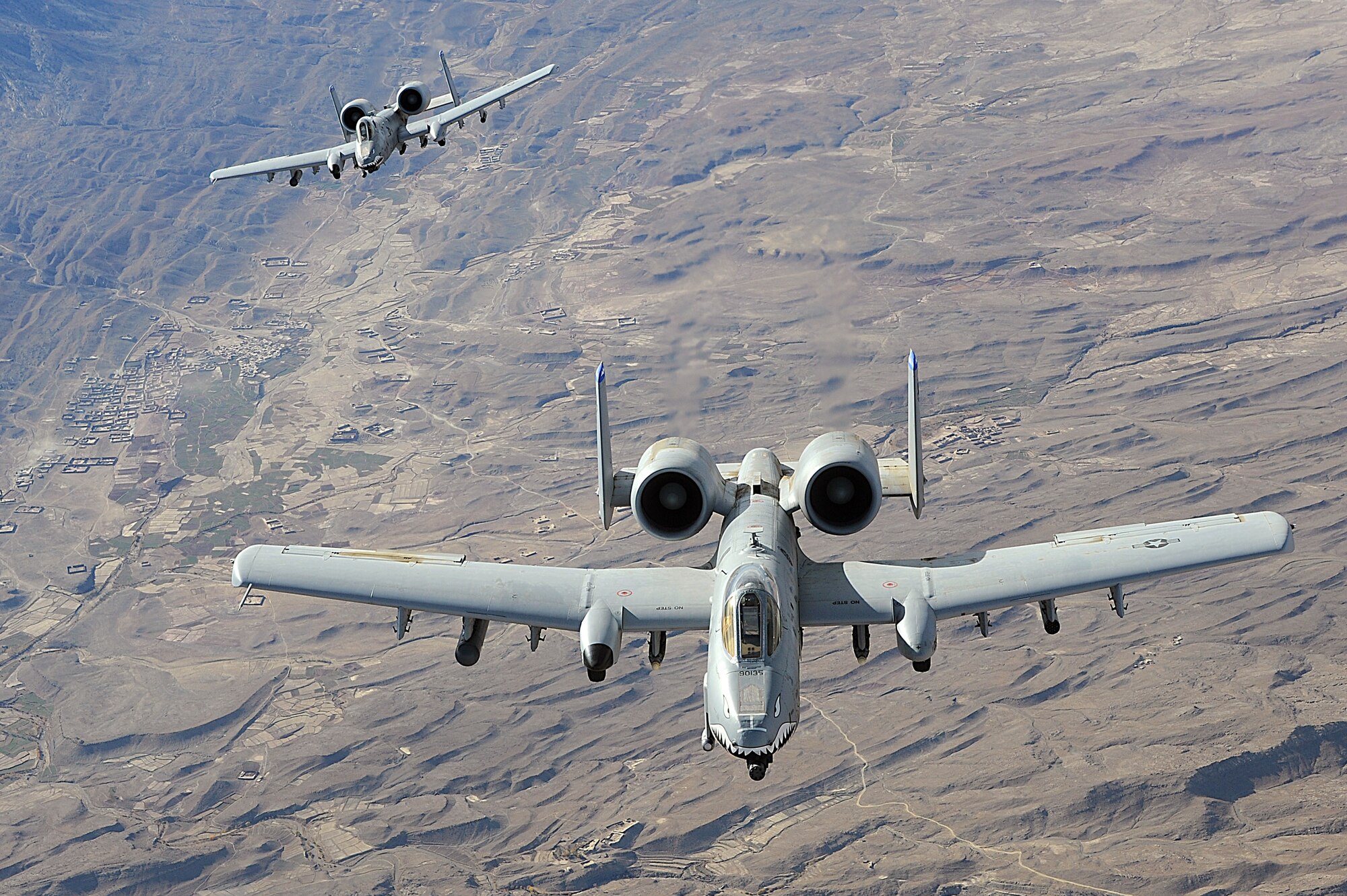 Two A-10 Thunderbolt IIs in-flight over Afghanistan supporting coalition forces. A-10s performs shows of force to deter enemy activities and provide armed aerial overwatch in support of Operation Enduring Freedom.  (U.S. Air Force photo/Staff Sgt. Aaron Allmon)