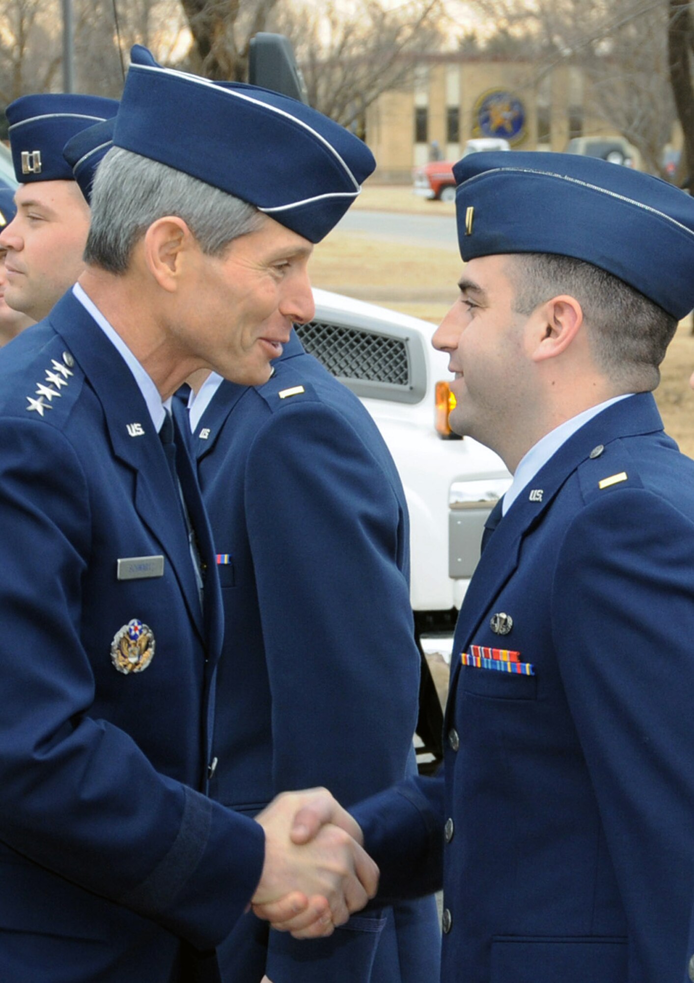 Air Force Chief of Staff Gen. Norton Schwartz congratulates 2nd Lt. Christopher McGarvey on receiving his pilot wings at the Class 09-04 graduation Jan. 23 at Vance Air Force Base, Okla. General Schwartz was the keynote speaker at the graduation. Lieutenant McGarvey has an assignment to fly C-17 Globemaster IIIs at Travis AFB, Calif. (U.S. Air Force photo/Terry Wasson)