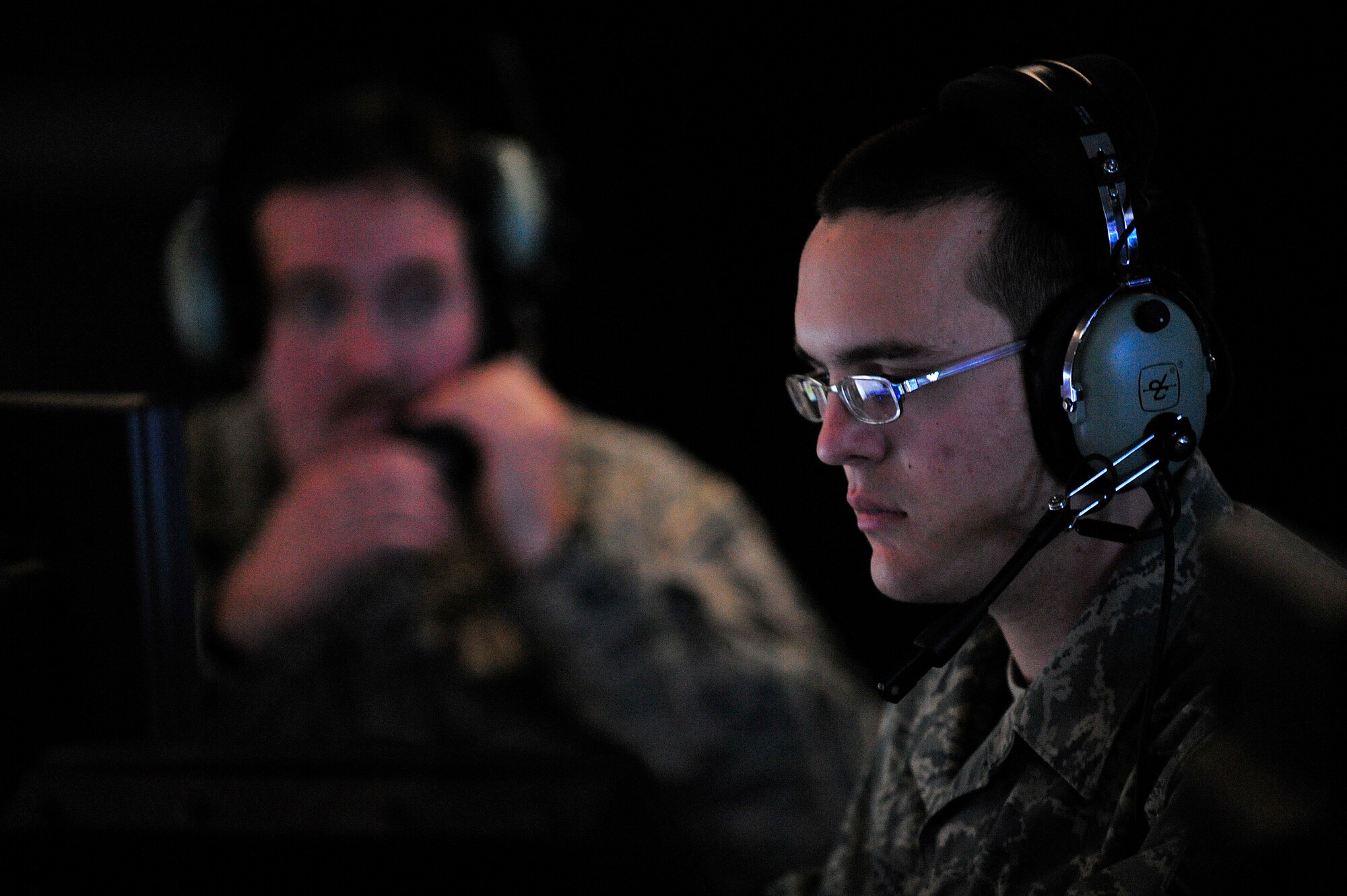 JOINT BASE BALAD, Iraq -- Senior Airman Daniel Shaub, 727th Expeditionary Air Control Squadron air surveillance technician, concentrates on a screen depicting Iraqi air space in the Control Response Center here Jan. 29.  Members of the 727th EACS are observing the sky and polling stations to give confidence to the Iraqi people and support them while they vote in the 2009 Iraqi provincial elections. Shaub is deployed here from the Kansas Air National Guard. (U.S. Air Force photo/Senior Airman Elizabeth Rissmiller)
