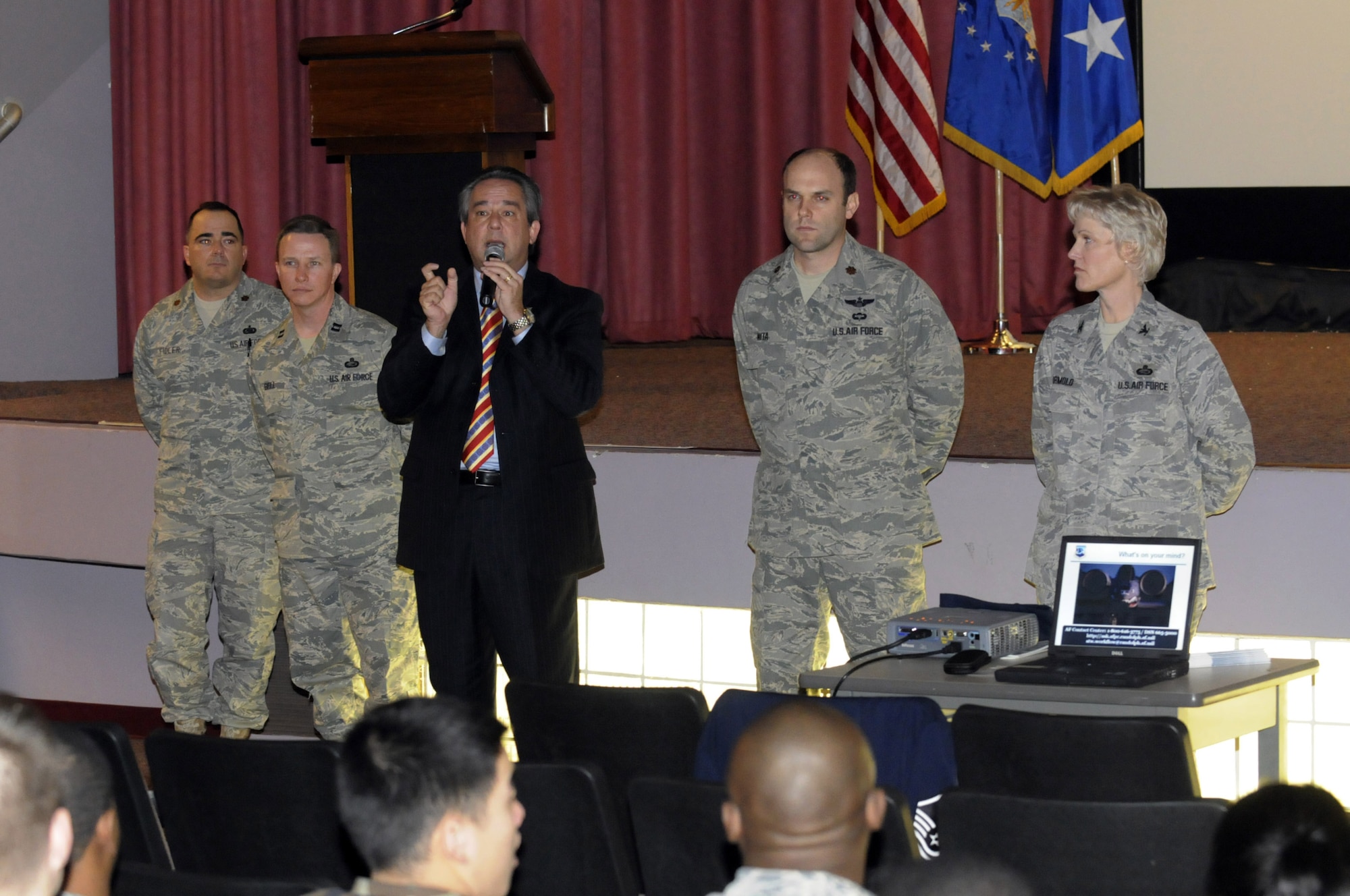 L-R,Maj. Paul Fidler, Capt Ron Bell, Jim Hale, Capt Greg Nita, and Col. Leslie Formola, Air Force Personnel Center, Randolph AFB, Texas, answer questions from the audience during a "Spread the Word" briefing here at the base theater Jan 26. The group was here at Robins to answer questions about personnel issues and delivery transformation. U. S. Air Force photo by Sue Sapp