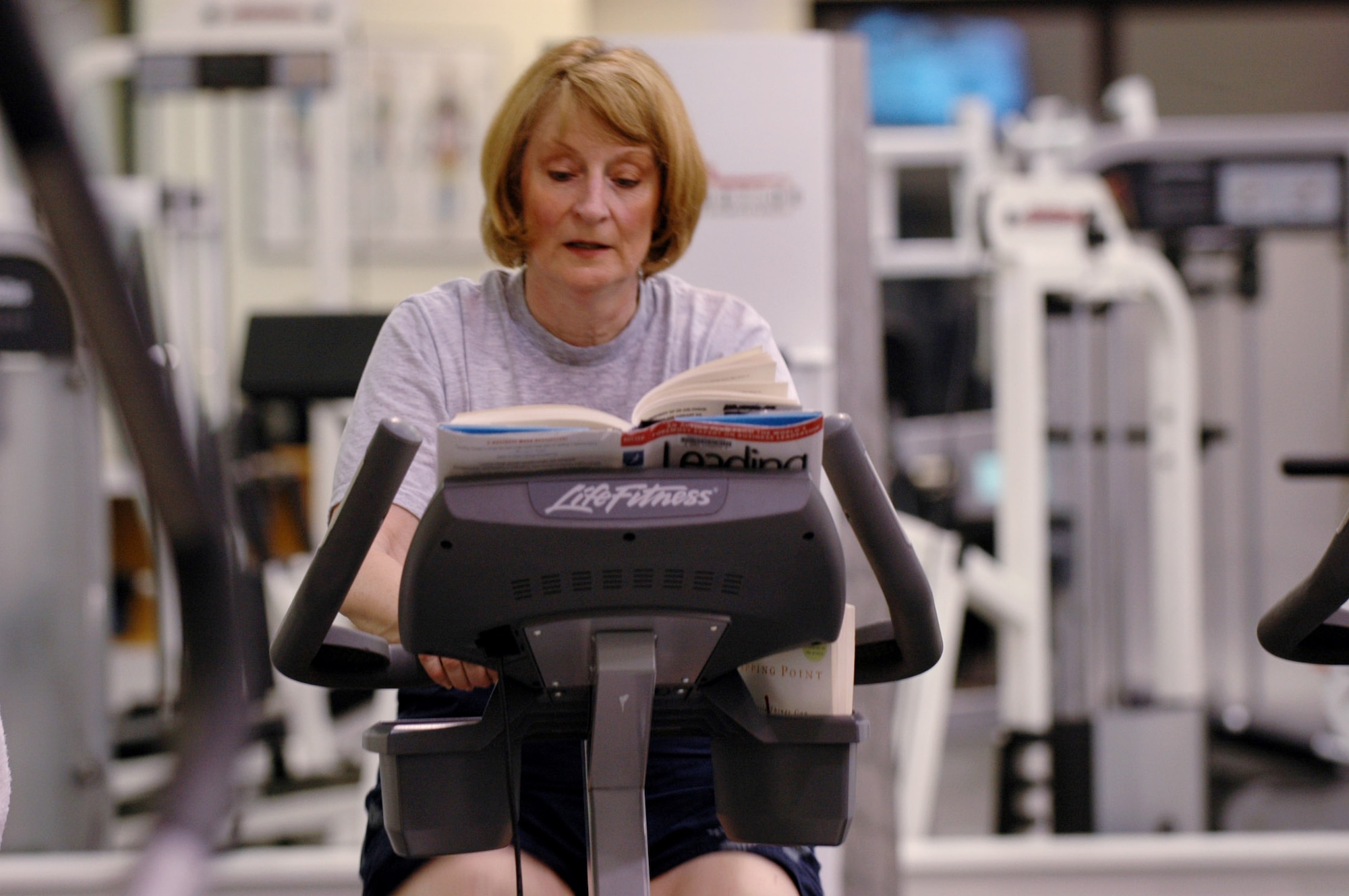 Maj. Gen. Polly Peyer, Warner Robins Air Logistics Center commander, promotes both exercise and reading. U. S. Air Force photo by Sue Sapp