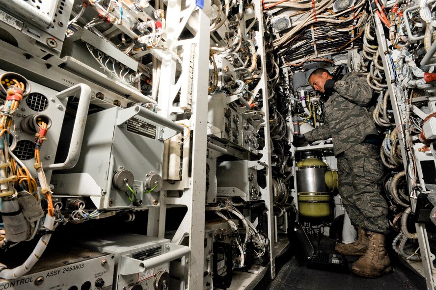 Staff Sgt. Marvin Fleming, an Electrical and Environmental Technician for the 7th Aircraft Maintenance Unit, performs maintenance on the back up oxygen system of a B-1B Lancer, Jan. 29, 2009, in an undisclosed location in Southwest Asia.  The system provides the breathing oxgen to the aircrew while on missions.  Sergeant Fleming is a native of Long Beach, Calif. and is deployed from Dyess Air Force Base, Texas in support of Operations Iraqi and Enduring Freedom and Combined Joint Task Force - Horn of Africa.(U.S. Air Force Photo by Staff Sgt. Joshua Garcia/released)