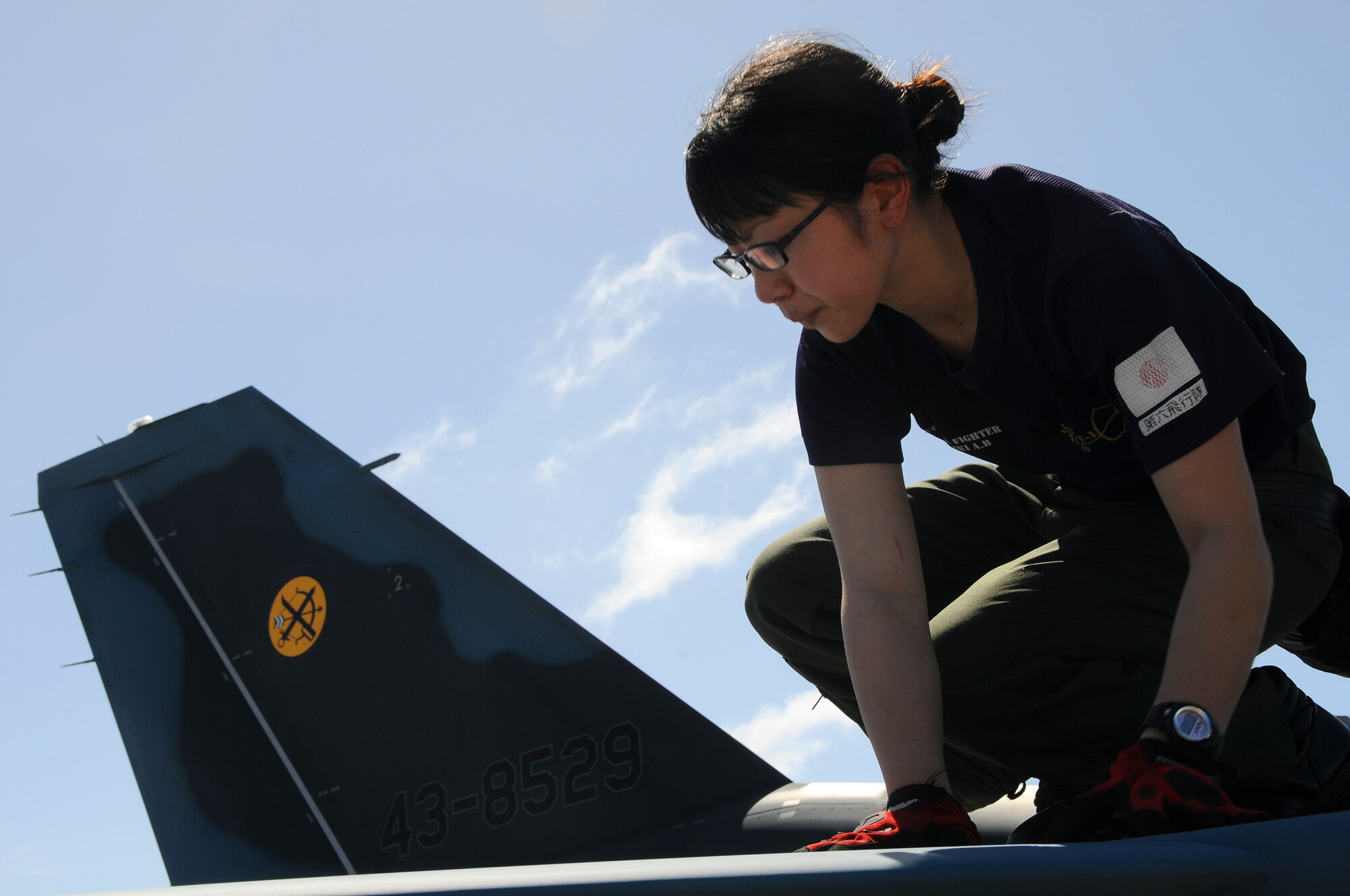 ANDERSEN AIR FORCE BASE, Guam - Japan Air Self Defense Force maintainer Staff Sgt. Teraya Miho inspects a JASDF F-2 fighter's horizontal stabilizer after its arrival at here Jan. 30 for participation in Cope North. The Cope North exercise is one of the longest-running series of exercises in the Pacific theater. Since the first Cope North exercise in 1978, thousands of American and Japanese personnel have honed skills that are vital to maintaining a high level of readiness.  (U.S. Air Force photo by Airman 1st Class Courtney Witt)