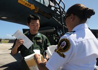 ANDERSEN AIR FORCE BASE, Guam - Guam Customs Officer Tommie Pablo greets Japan Air Self Defense Force F-2 fighter pilot Capt. Genji Tanaka after his arrival here Jan. 30. The F-2 Fighters arrived on Andersen to participate in Exercise Cope North 09-1, a regularly scheduled exercise scheduled for Feb.2-13. Cope North is designed to enhance U.S. and Japanese air operations in defense of Japan. The Cope North exercise is one of the longest-running series of exercises in the Pacific theater.  (U.S. Air Force photo by Senior Airman Nichelle Griffiths)