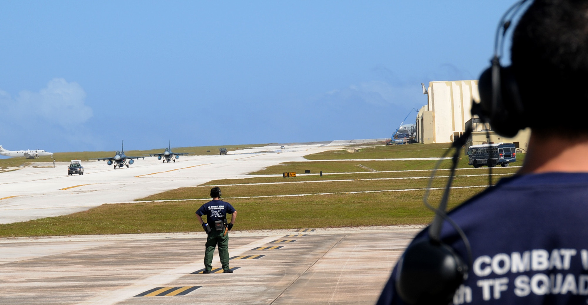 ANDERSEN AIR FORCE BASE, Guam - Japan Air Self Defense Force maintainers stand ready as two JASDF F-2 attack fighters taxi down the flight line here Jan. 30. The F-2's arrived at Andersen to participate in exercise Cope North. The exercise is one of the longest-running series of exercises in the Pacific theater. Since the first Cope North exercise in 1978, thousands of American and Japanese personnel have honed skills that are vital to maintaining a high level of readiness. (U.S. Air Force photo by Senior Airman Nichelle Griffiths)