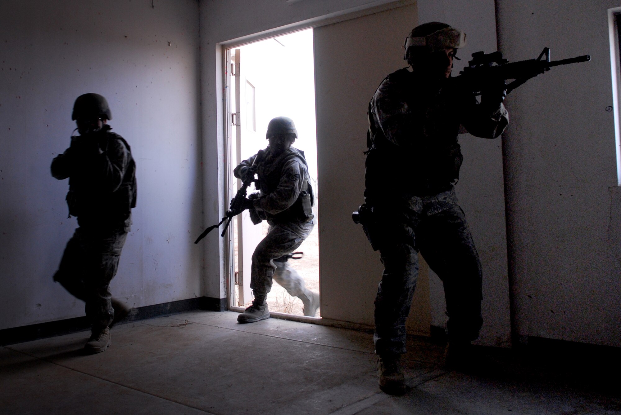 Security Forces Airmen clear and secure a room during a 51st Security Forces Squadron combat readiness course Jan. 22 on Osan AB. Newly arriving security forces Airmen go through a six-day combat readiness course designed to prepare SF Airmen by giving them the tools needed to perform the mission. (U.S. Air Force photo/Senior Airman Christopher Boitz)