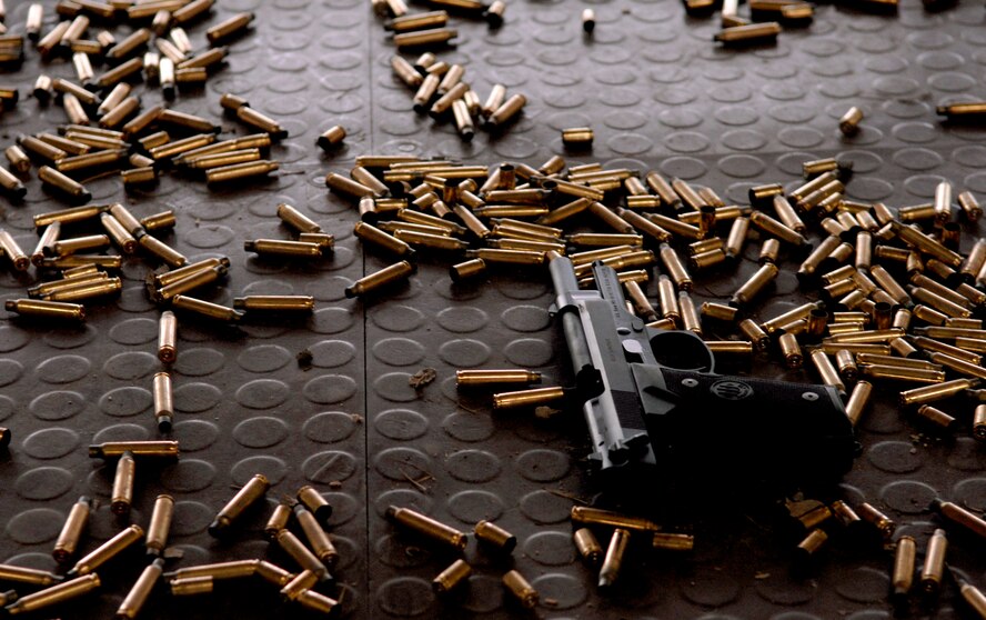 A M9 pistol sits on the floor of the Osan AB firing range, Jan 22, after being disassembled and reassembled by a 51st Security Forces Squadron Airman. Newly arriving security forces Airmen go through a six-day combat readiness course designed to prepare SF Airmen by giving them the tools needed to perform the mission. (U.S. Air Force photo/Staff Sgt Brian Ferguson)