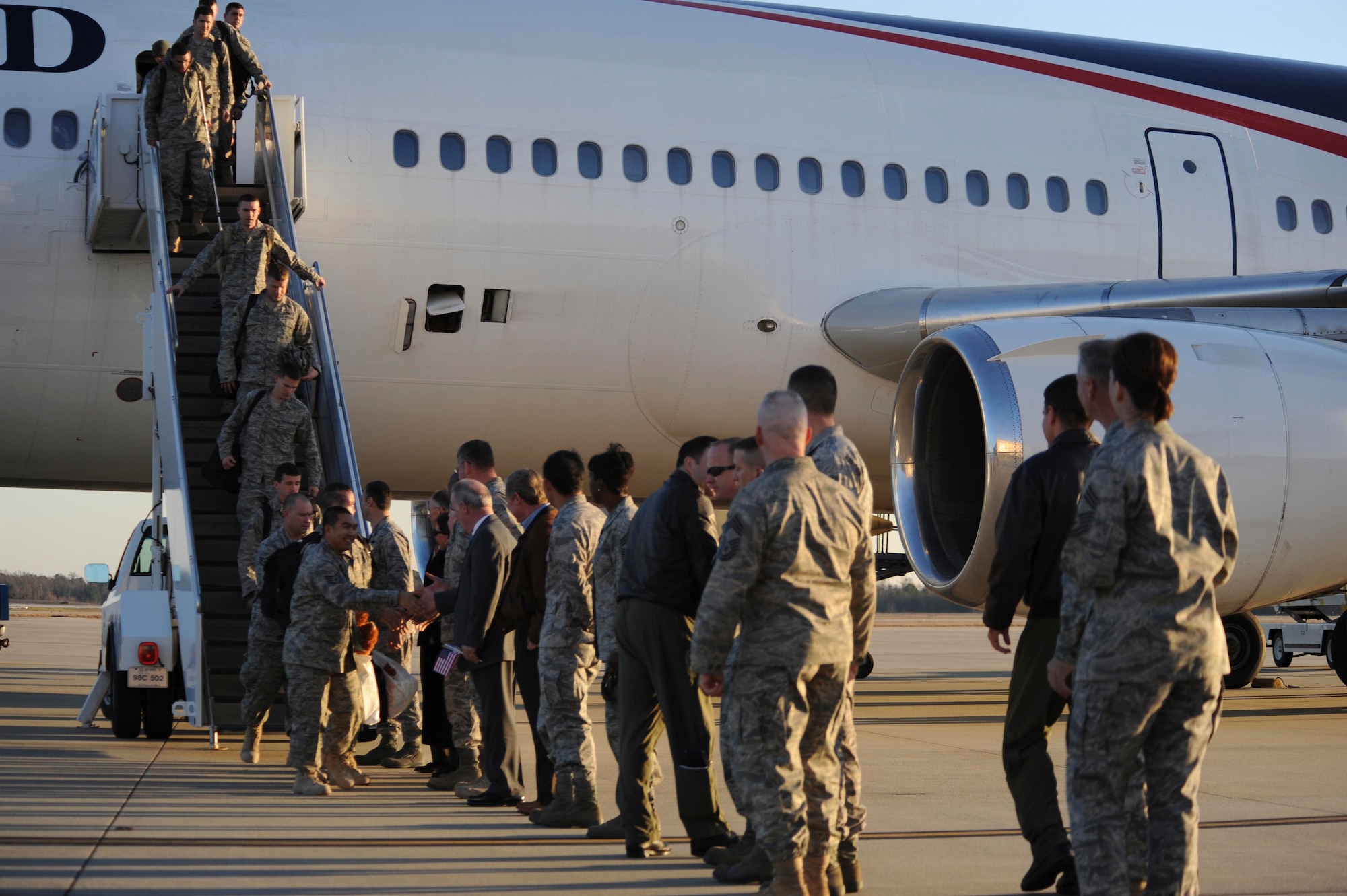 SHAW AIR FORCE BASE, S.C.-- Airmen shake hands with members from Shaw and the Sumter community as they make their way towards family and friends. About 300 Airmen from the 20th Fighter Wing returned to Shaw AFB at around 5 p.m. today after a four-month deployment to Iraq. (U.S. Air Force photo/Senior Airman Matthew Davis)