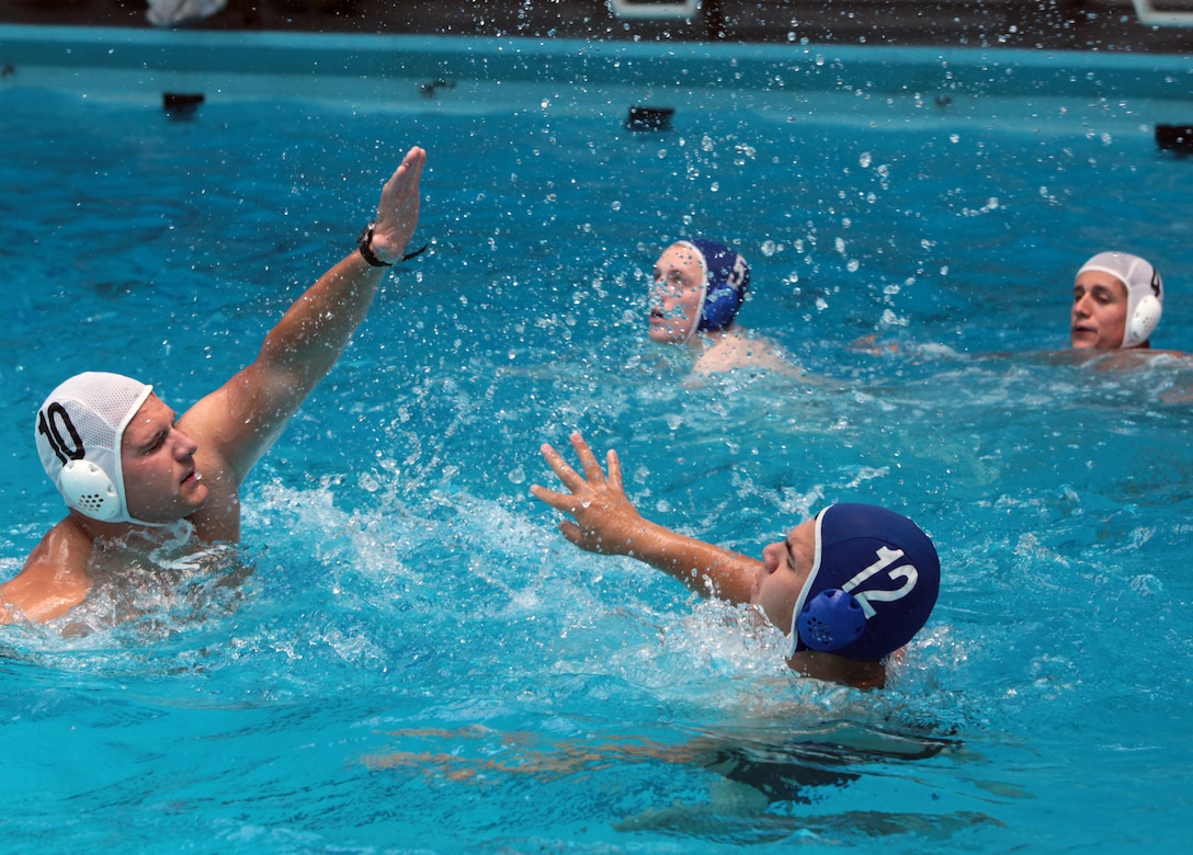 Marines from Headquarters Battalion, 2nd Marine Division, compete in a water polo tournament at the Area 5 Training Tank aboard Marine Corps Base Camp Lejeune, N.C., May 13, 2011. The day's event marked the seventh leg of the Commander’s Cup, a nine-event competition intended to build camaraderie throughout the battalion.