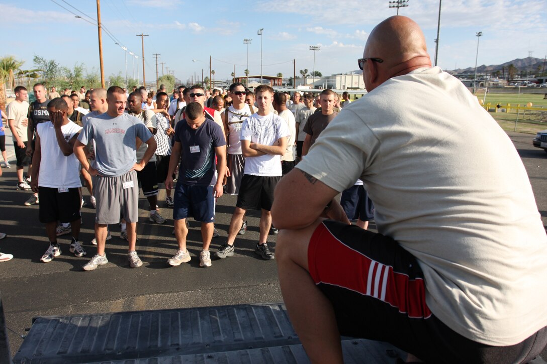 Sgt. Maj. Mark M. Geletko, the sergeant major of Headquarters Battalion, announces to runners the route of the first 5K Coyote Desert Fun Run beginning at Victory Field July 2.