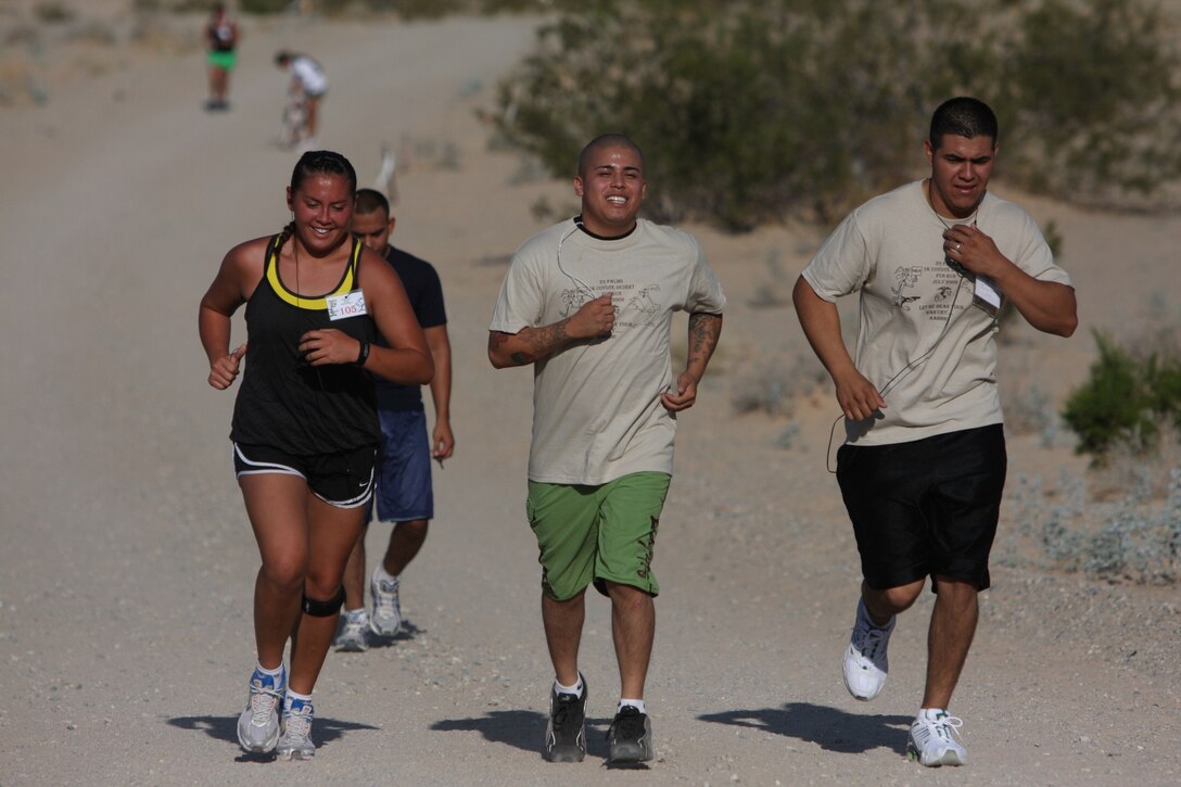 Several Marines from the CMSC section, Headquarters Battalion, ascend the steep portion of the first 5K Coyote Desert Fun Run hosted by the Combat Center's Installation Personnel Administration Center July 2.