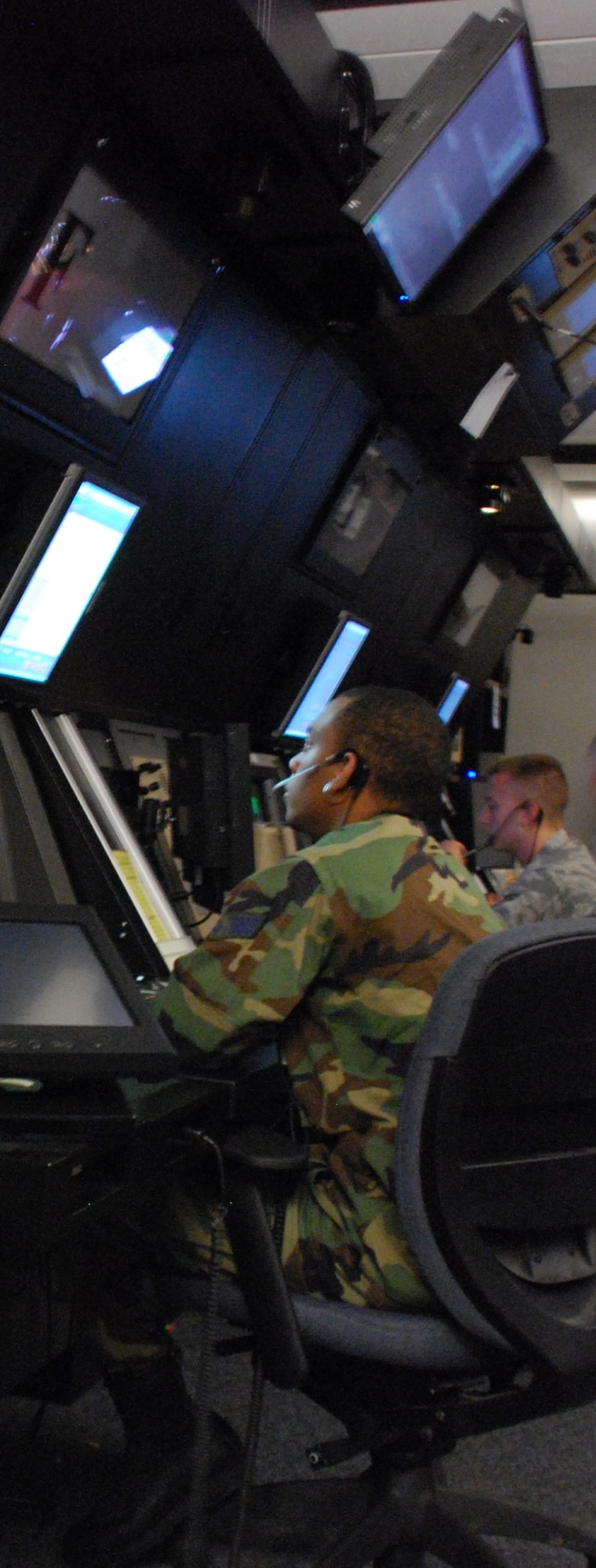 Senior Airman L’Aaron Odum, 80th Operations Support Squadron, is giving control instructions to multiple aircraft operating in the Military Operations Areas from the Radar Approach Control facility July 1. 