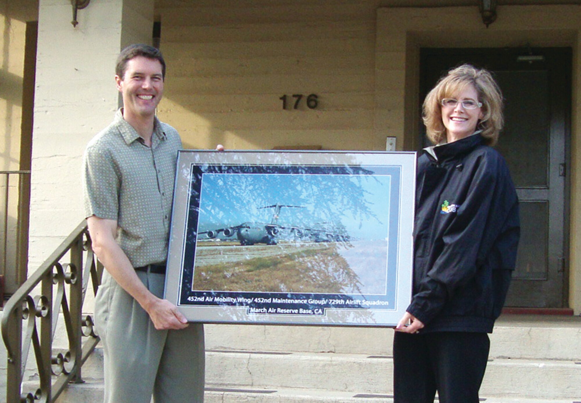 Colonel Jeff Barnson, 452 AMW vice commander, and his wife, Kelly, accept a going away gift from Brig. Gen. James Melin, 452 AMW commander, on behalf of the men and women of the wing during Col. Barnson’s farewell dinner at the Hap Arnold House on Saturday, June 13. Col. Barnson has been assigned to March Air Reserve Base since September 1997 and previously held various positions throughout the wing, to include commander of the 452nd Operations Support Squadron and Inspector General. He is now assigned as Senior Individual Mobilization Assistant to the Director, Global Readiness, TACC/XOP at Scott AFB, Ill. (U.S. Air Force photo by Major Don Traud)
