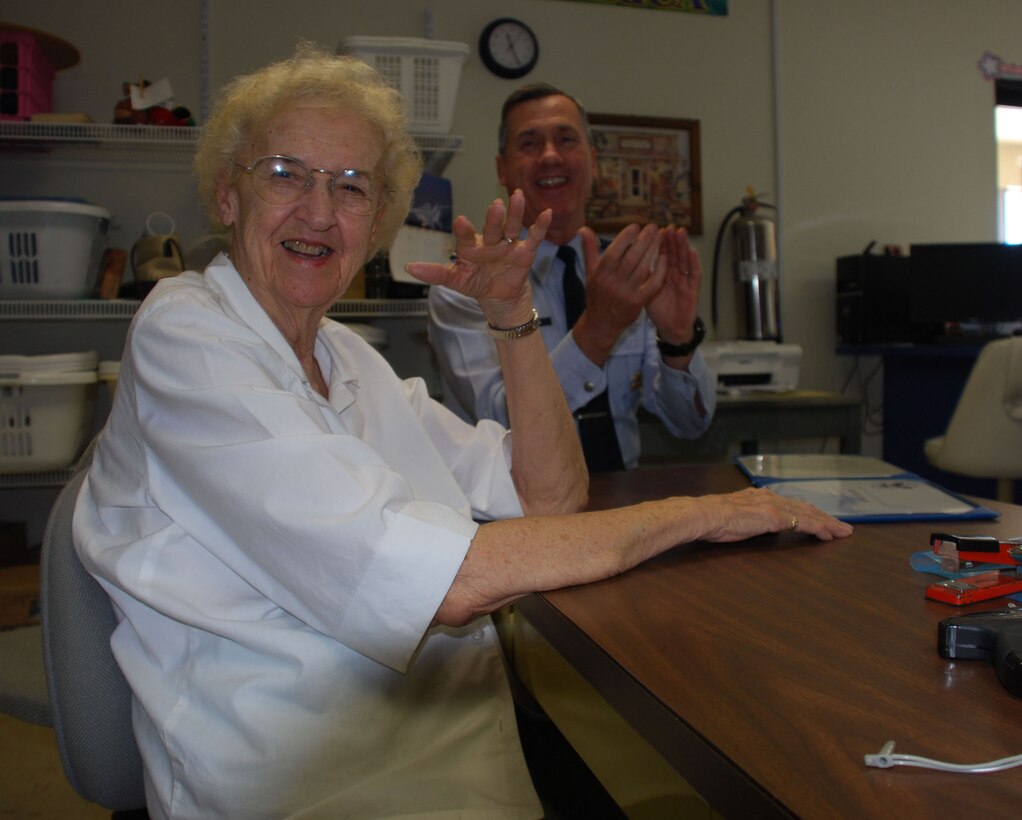 Brig. Gen. O.G. Mannon (back), 82nd Training Wing commander, applauds Bernice Wallig for her receipt of a President's Volunteer Service Award from President Barack Obama July 1 at the Sheppard Thrift Store. Mrs. Wallig has volunteered at the store since 1978, a venture that has won her several command and Air Force-level awards. (U.S. Air Force photo/John Ingle)