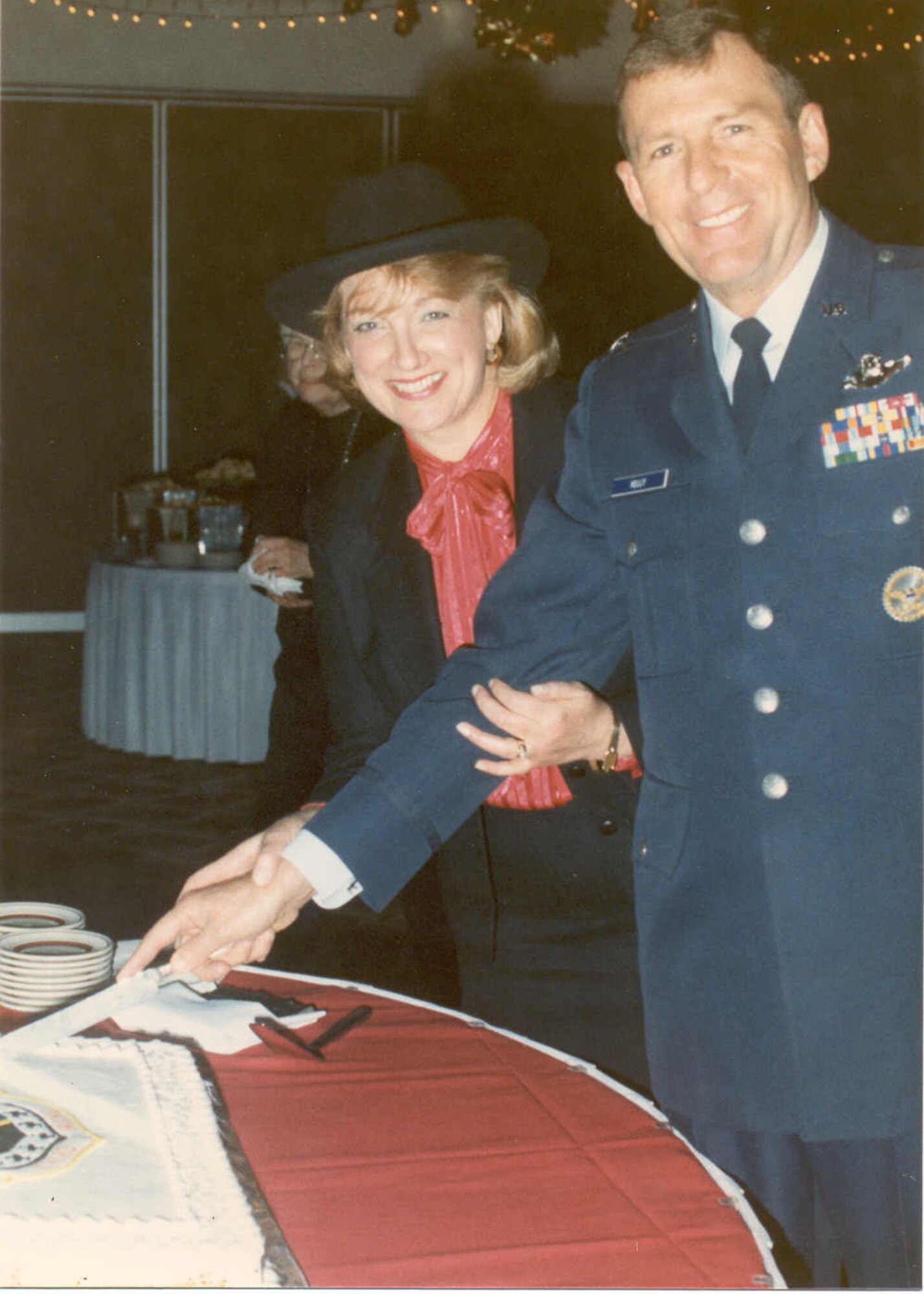 ELMENDORF AIR FORCE BASE, Alaska -- Col. Rodney Kelly and his wife cut the cake during the gathering following the 3rd Wing activation ceremondy December 19, 1991.(Courtesy photo)