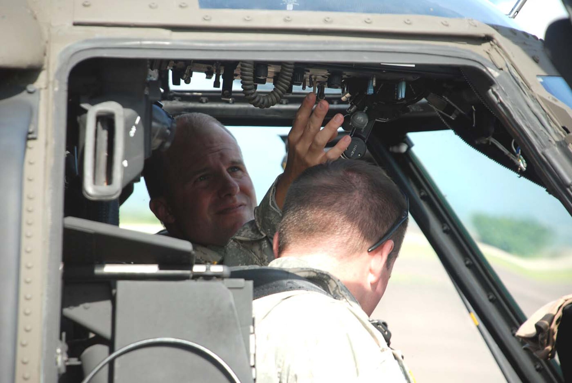SOTO CANO AIR BASE, Honduras — Army Chief Warrant Officer Kyle Cheeseman and Chief Warrant Officer Derek Griblin run through pre-flight checks in the cockpit of the UH-60 Blackhawk. The Blackhawk crew, along with two other helicopters assigned to Joint Task Force-Bravo, will support the hospital ship USNS Comfort’s humanitarian and civic assistance mission in Nicaragua. (U.S. Air Force photo by Staff Sgt. Chad Thompson).