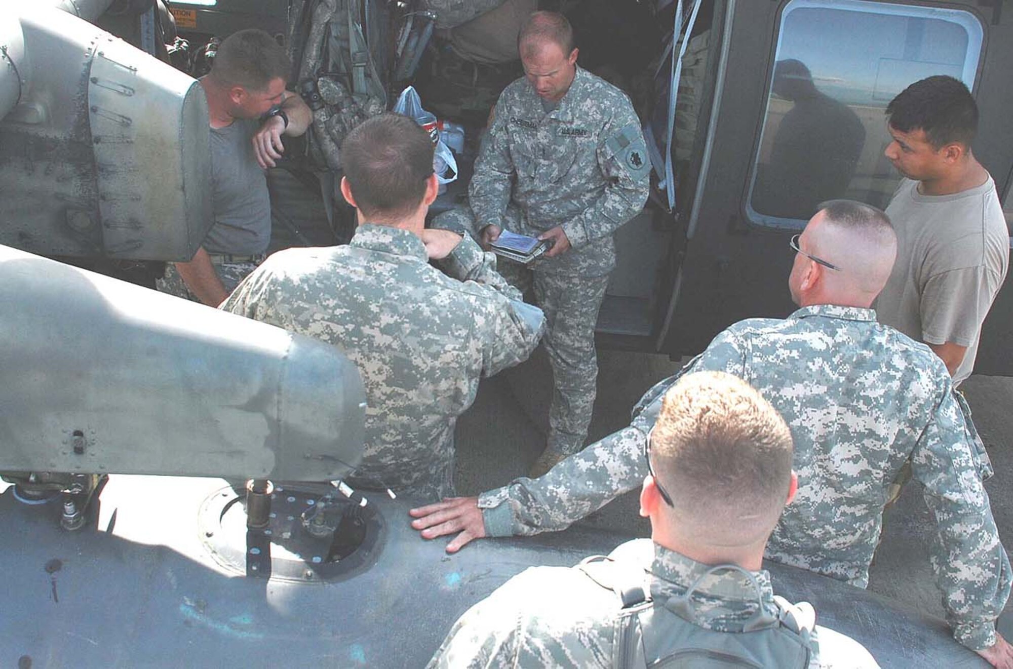 SOTO CANO AIR BASE, Honduras — Army Chief Warrant Officer Kyle Cheeseman gives a pre-flight briefing to members of the 1st Battalion, 228th Aviation Regiment here today prior departing to Nicaragua. The Blackhawk crew, along with two other helicopters assigned to Joint Task Force-Bravo, will support the hospital ship USNS Comfort’s humanitarian and civic assistance mission in Nicaragua. (U.S. Air Force photo by Staff Sgt. Chad Thompson).