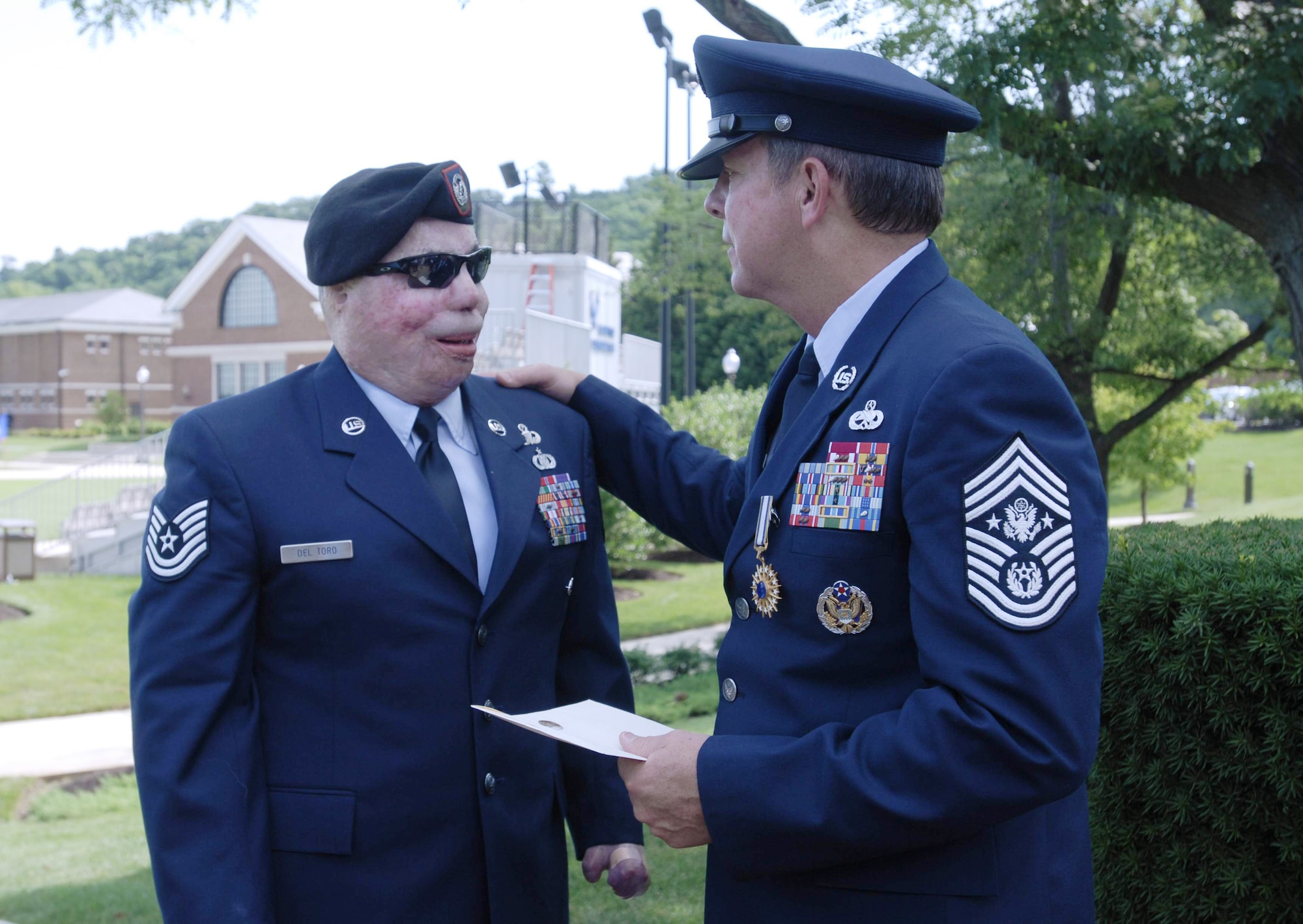 Chief Master Sgt. of the Air Force Rodney J. McKinley chats with Tech. Sgt. Israel Del Toro June 30 at Bolling Air Force Base, D.C. Chief McKinley retired and Chief Master Sgt. of the Air Force James A. Roy was appointed as the Air Force's 16th top enlisted leader. (U.S. Air Force photo/Scott Ash)