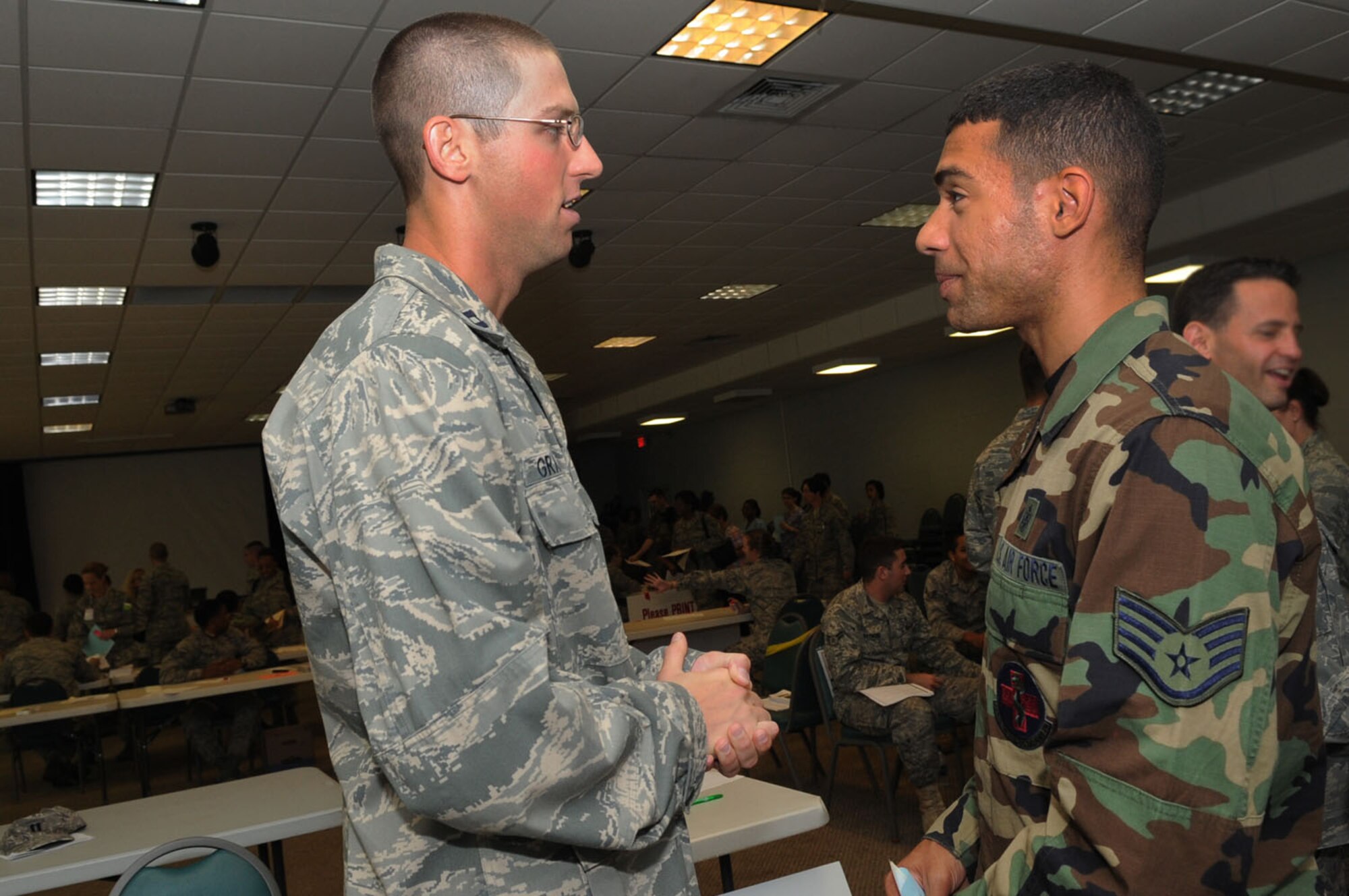 LANGLEY AIR FORCE BASE, Va. -- Capt. Doug Grabowski, 1st Medical Group dental officer, informs a patient on where to go during the first multi-facility Skeeter Swatt 2009 exercise here June 18. The exercise evaluated how well the 1st MDG coordinated with local emergency management organizations to dispense medication following a simulated Anthrax outbreak. (U.S. Air Force photo/Senior Airman Ashley Hawkins)