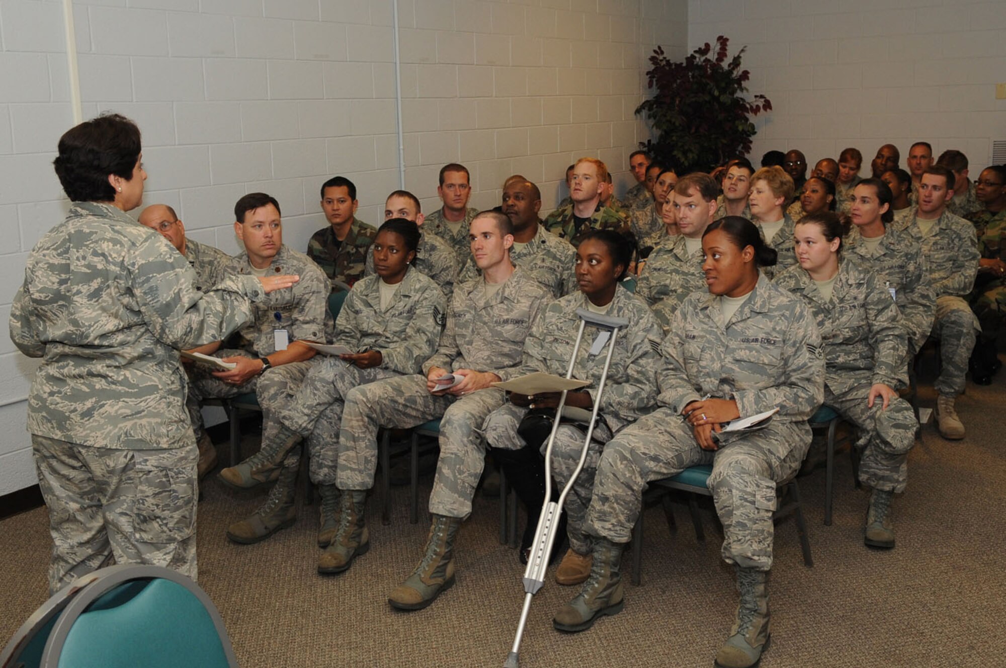 LANGLEY AIR FORCE BASE, Va. -- Maj. Sylvia Cruz, 1st Medical Group clinical nurse, briefs personnel on the side effects of their medication, during the first multi-facility Skeeter Swatt 2009 exercise here June 18. The exercise evaluated how well the 1st MDG coordinated with local emergency management organizations to dispense medication following a simulated Anthrax outbreak. (U.S. Air Force photo/Senior Airman Ashley Hawkins)