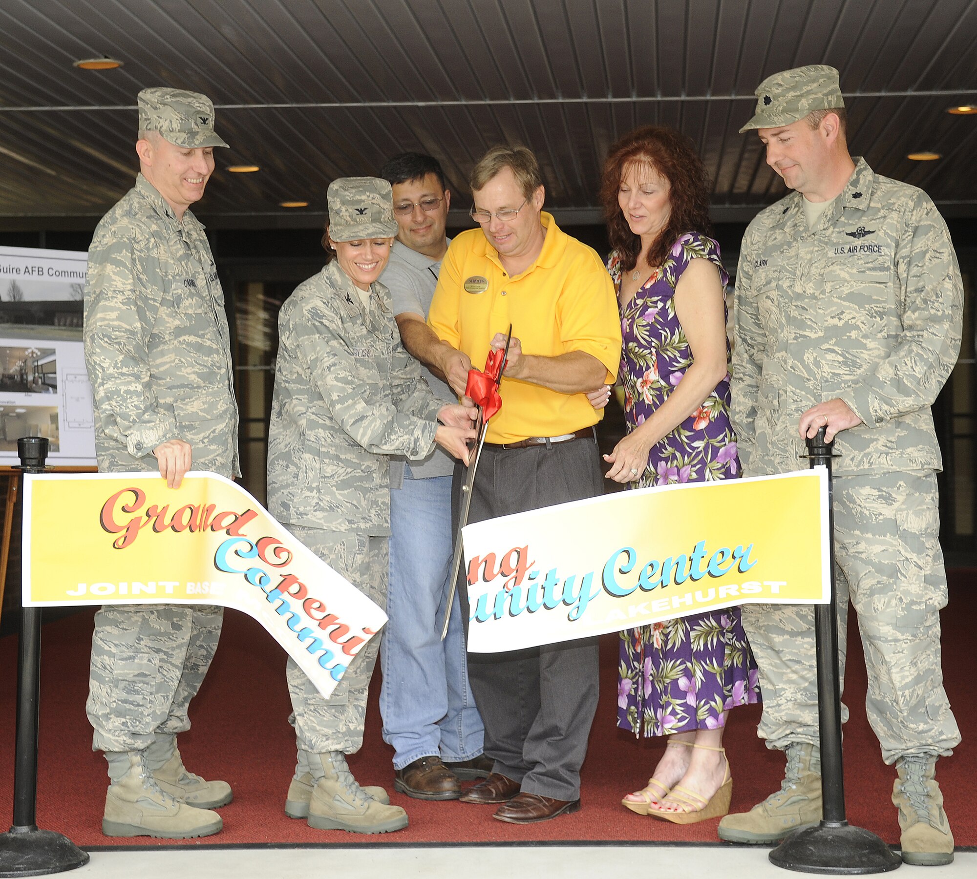 Colonel Mike Carrell 87th Mission Support Squadron Commander, Col. Gina Grosso 87th Air Base Wing Commander, Al Lora 87th Civil Engineering Squadron, Steve Pivin Community Support Flight Chief, Peggy Vellestari Club Manager, and Lieutenant Colonel John Clark 87th Force Support Squadron all participate in a Ribbon Cutting Ceremony for the newly renovated Community Center. The ceremony took place on 26 June on McGuire Air Force Base.  (U.S. Air Force photo/Carlos Cintron)
