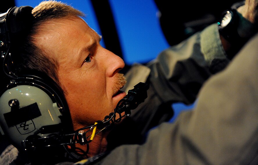 MOODY AIR FORCE BASE, Ga. -- Tech. Sgt. Kenneth Miller, 71st Rescue Squadron
flight engineer, performs a fuel check prior to departure here July 1.
Sergeant Miller performed the task to ensure the aircraft was ready for
flight to Australia. (U.S. Air Force photo by Airman 1st Class Joshua Green)
