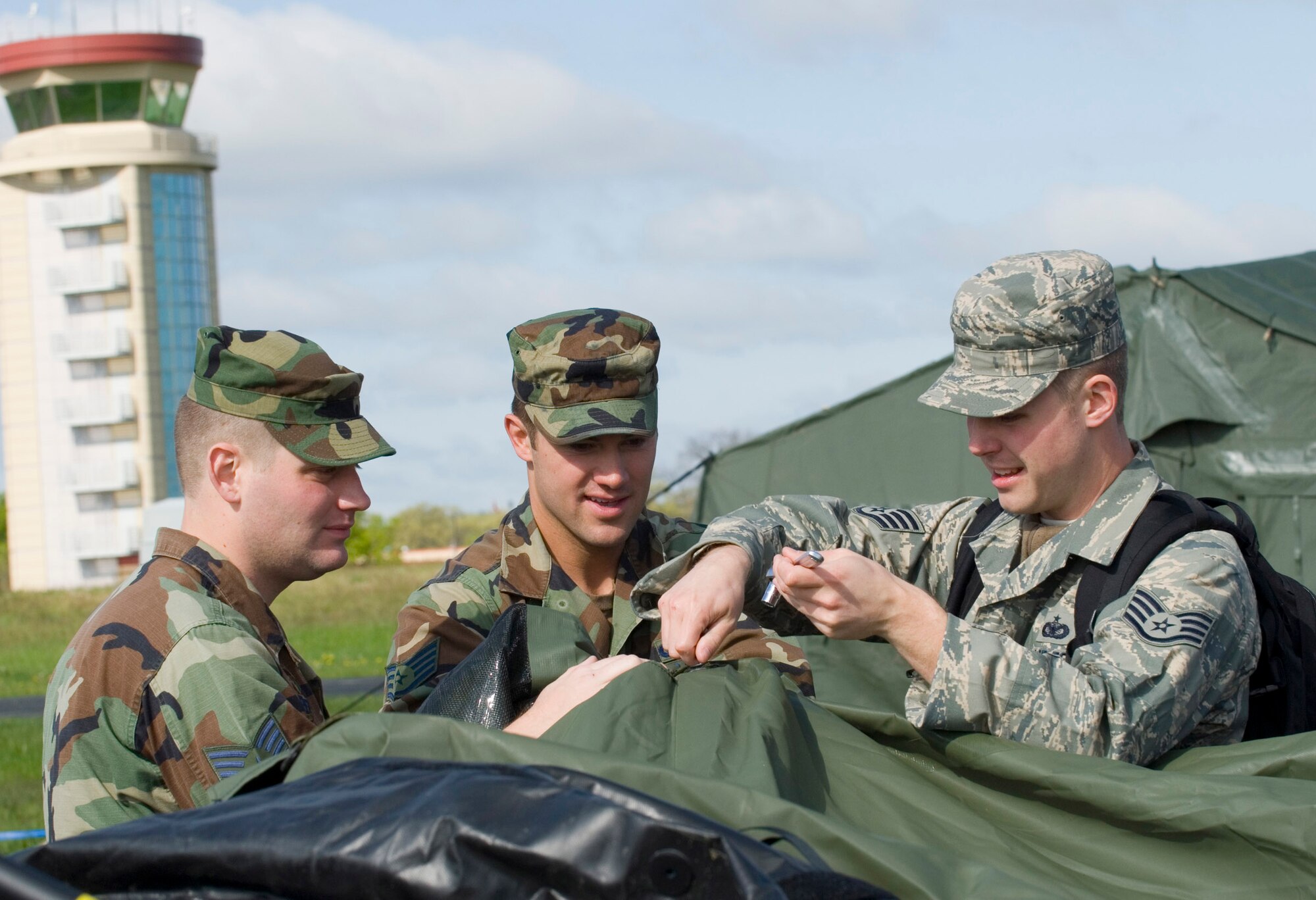 Minnesota Air National Guard Airmen of the 133rd Airlift Wing take apart a tent during a training exercise at Volk Field, Wis., May 14, 2009. Hundreds of men and women from the Minnesota Air National Guard joined Scott Air Force Base, Ill., Guardsmen for Exercise Readiness Safeguard at Volk Field, in preparation for an operational readiness inspection. (U.S. Air Force photo by Tech. Sgt. Erik Gudmundson/Released)