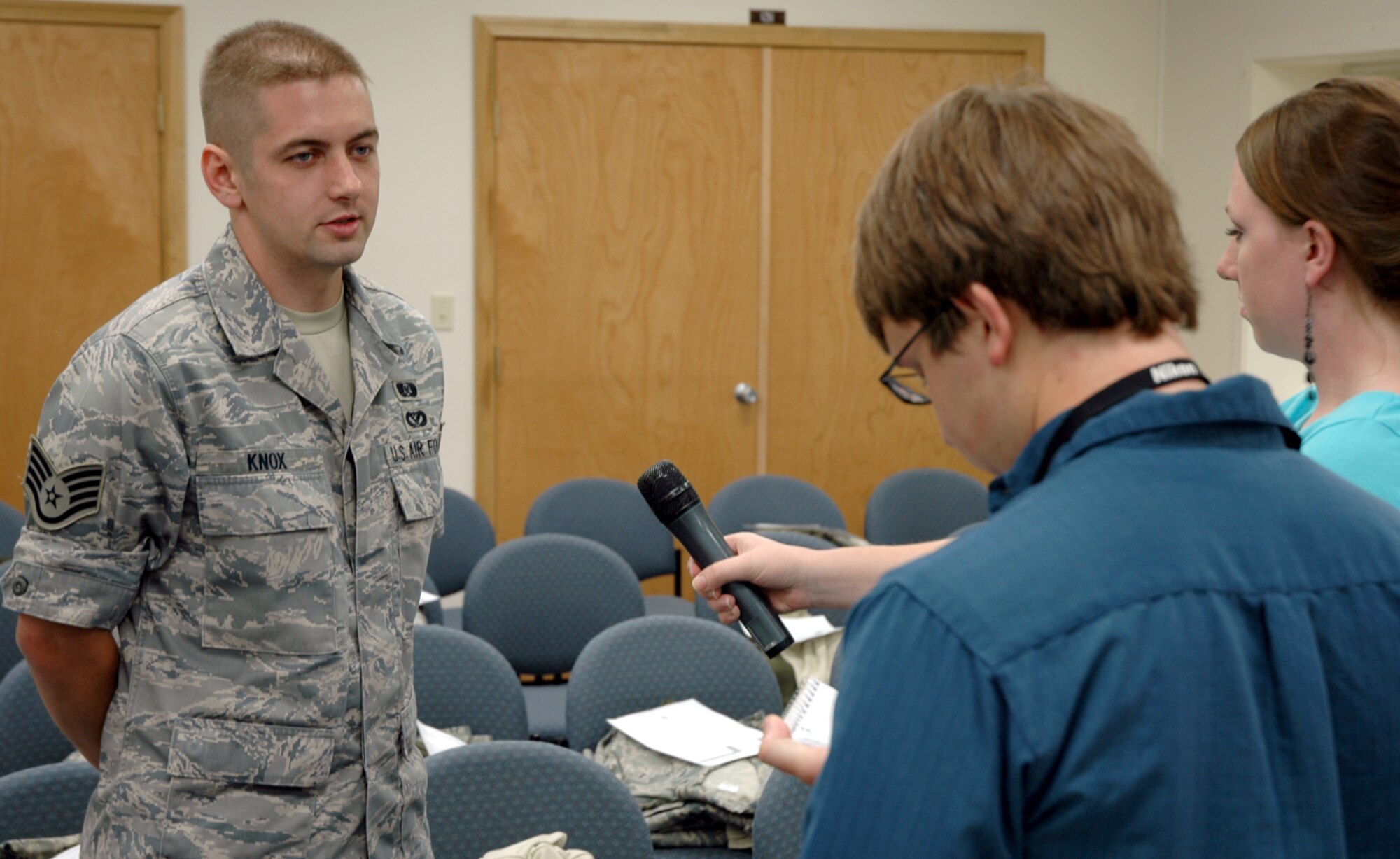 YOUNGSTOWN AIR RESERVE STATION, Ohio -- U.S. Air Force Reservist Staff Sgt. Kyle Knox, an emergency management journeyman assigned to the 910th Civil Engineers Squadron here, is interviewed by local news media at the CE training room here June 29, 2009.  Staff Sgt. Knox is one of approximately 20 CES Reservists that deployed June 29, 2009 to participate in a humanitarian mission in Guyana, South America to build a 2,800 square foot school for the community.  (U.S. Air Force photo by Airman Megan Tomkins) 