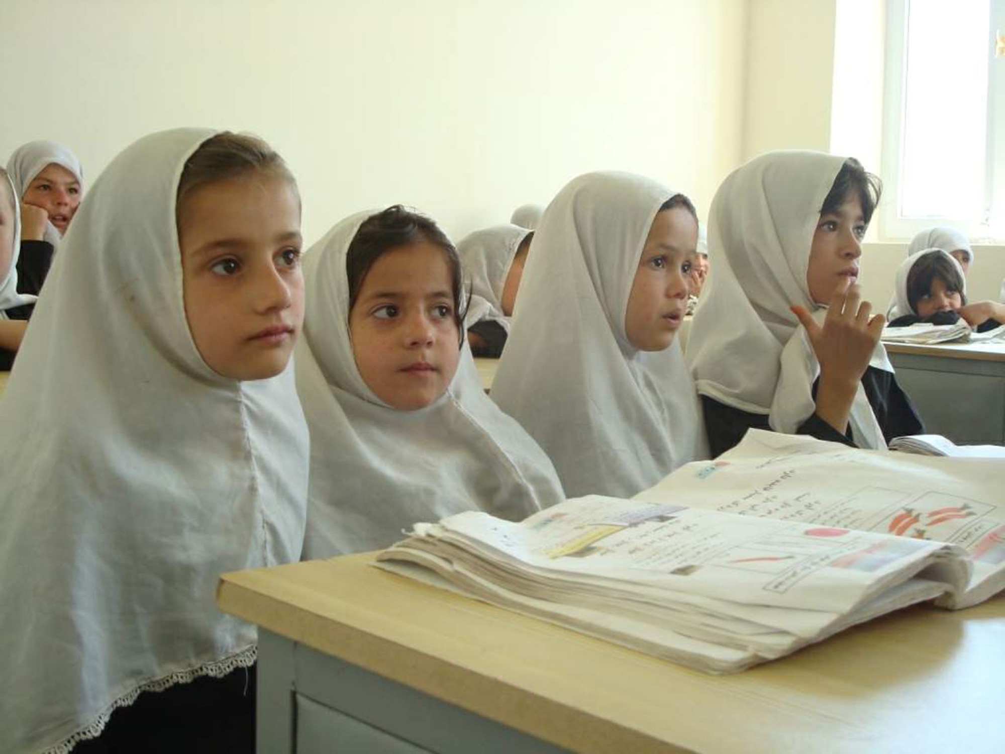 First grader girls sit at the newly opened eight-classroom Haish Saidqi Girls' School June 23 in the Panjshir Province, Afghanistan. According to the Afghan Ministry of Education, there are 1.7 million girls studying in primary schools across the country. (U.S. Air Force photo/Capt. Stacie N. Shafran) 

