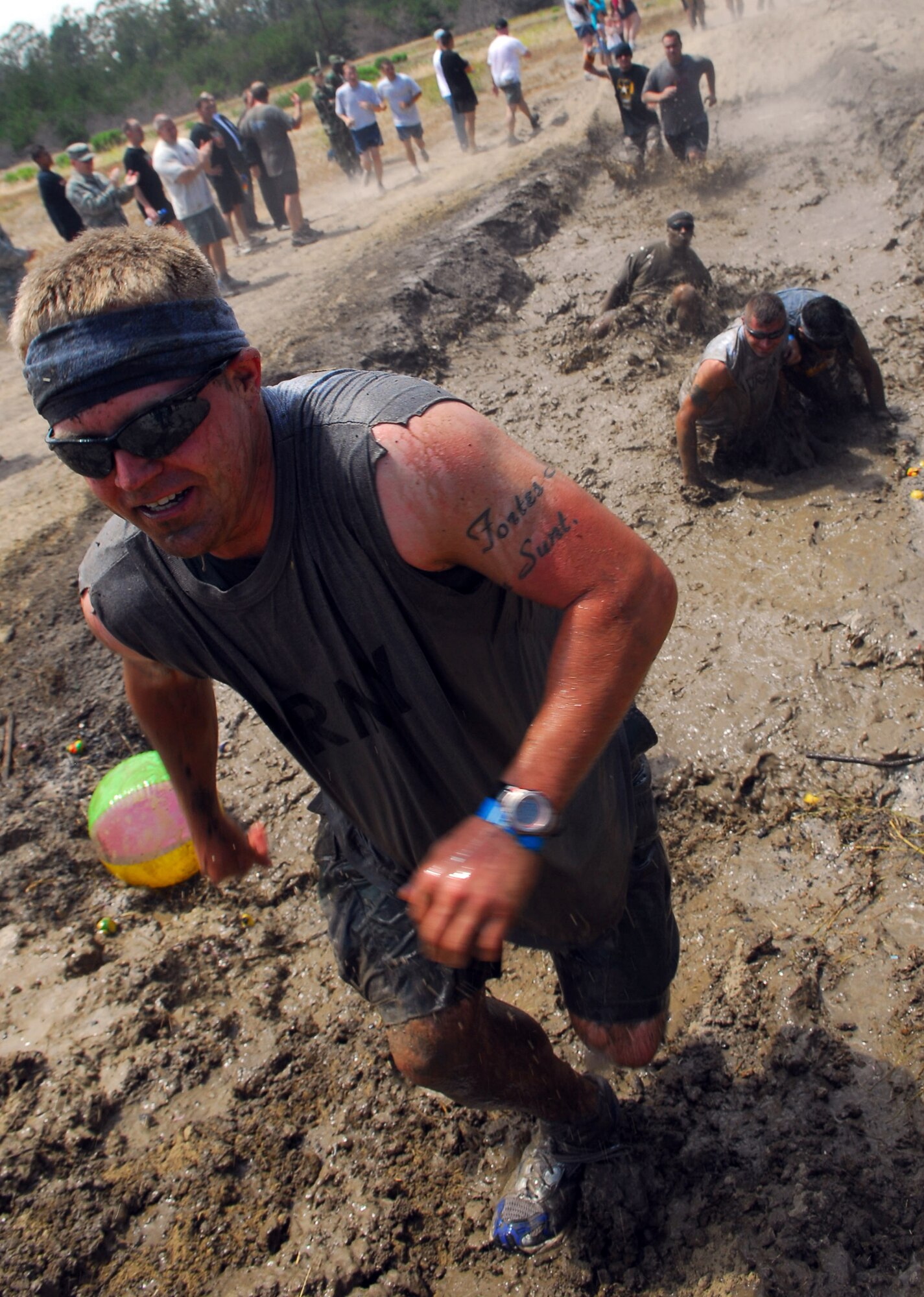 VANDENBERG AIR FORCE BASE, Calif. --Taking on the warrior role, members of Team V take part in the Vandenberg Warrior Challenge Mud Run on June 30 at Cocheo Park here. “The course was designed to test the physical and mental toughness needed to build warrior ethos, which is the foundation of what it means to be an Airman," said Master Sgt. Patrick Dutkevitch, the Vandenberg Mud Run coordinator. (U.S. Air Force photo/Airman 1st Class Kerelin Molina) 