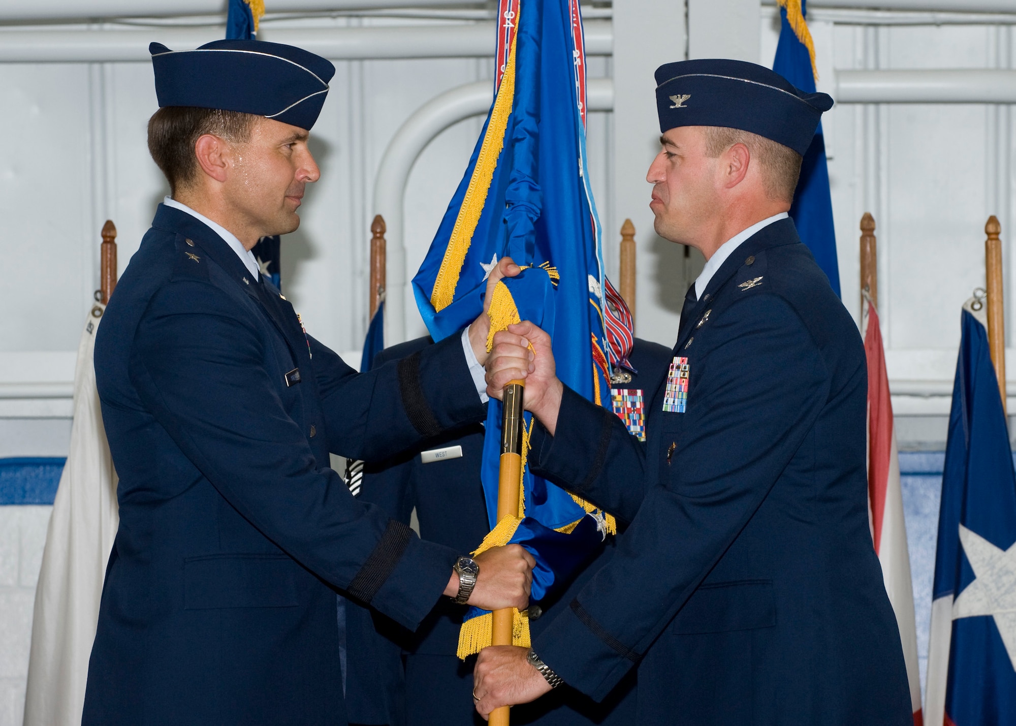Col. Michael Gantt accepts the 53rd Wing guidon from Brig. Gen. Ted Kresge, U.S. Air Force Warfare Center commander, during the assumption of command ceremony June 24 at Eglin Air Force Base.  Colonel Gantt left his position as the vice commander of the 31st Fighter Wing to take command of the 2,000-person wing.  (U.S. Air Force photo/Greg Murray)