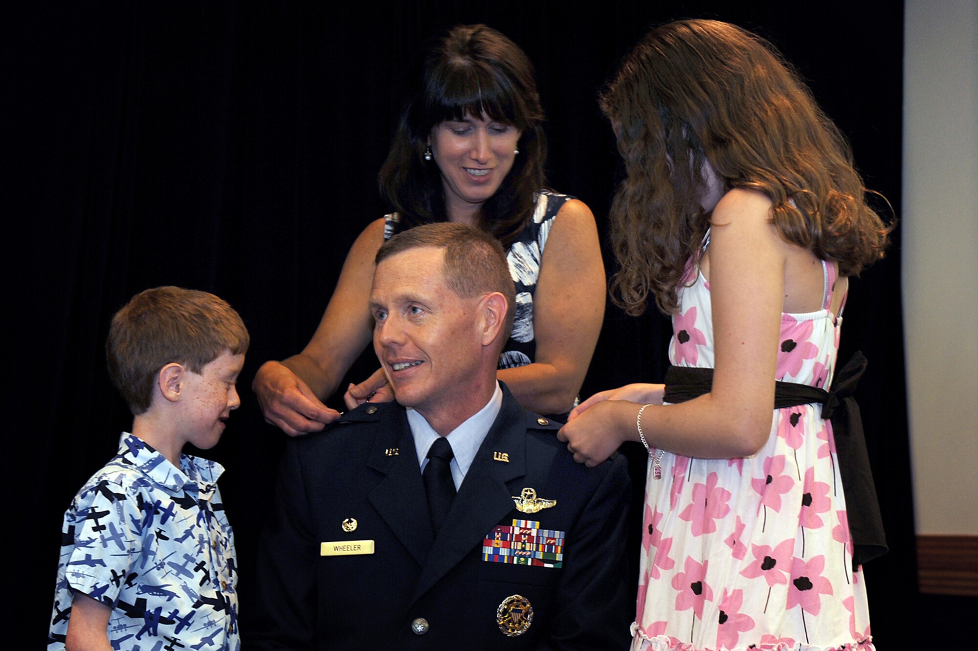 WHITEMAN AIR FORCE BASE, Mo. -  Brig. Gen. Robert Wheeler, 509th Bomb Wing commander, receives his Stars June 30 form his wife and children durign a promotion ceremony June 30. (U.S. Air Force photo/Senior Airman Jaosn Huddleston)