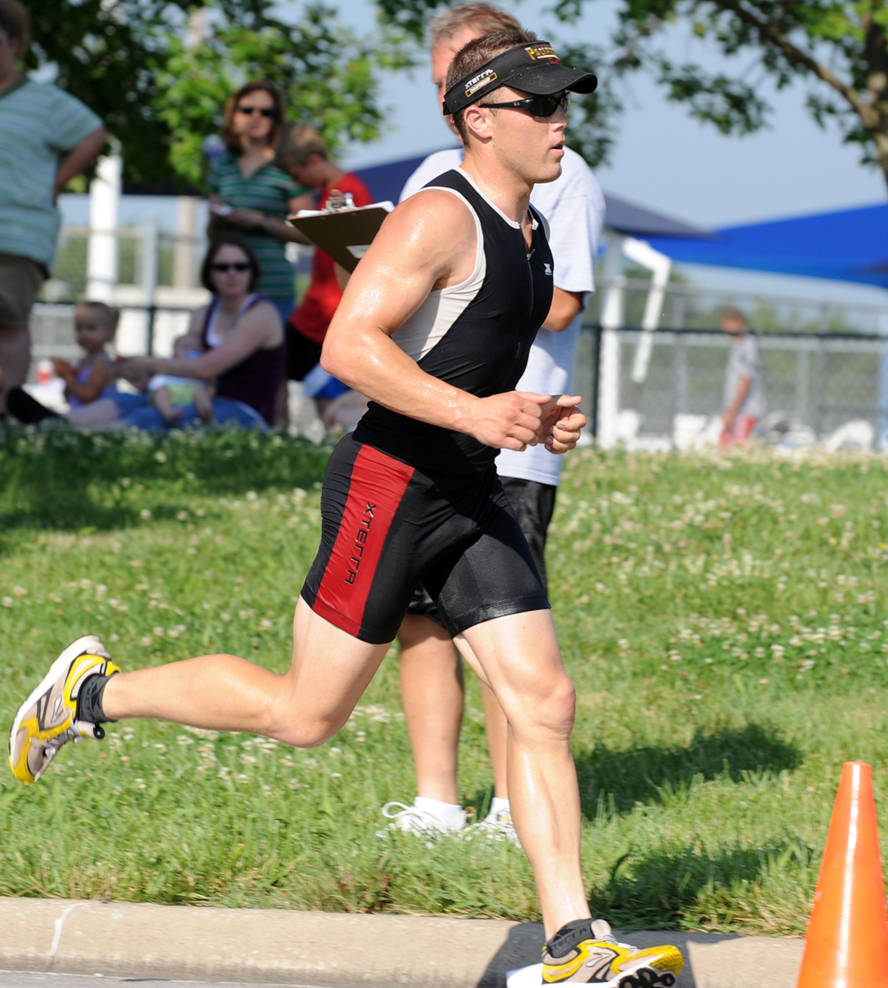 WHITEMAN AIR FORCE BASE, Mo. -  Staff Sgt. Brian Frank, 509th Logistics Readiness Squadron,  kicks out during the last few seconds of his completion during the triathlon. Sergeant Frank placed first with 45 minutes and 17 seconds in overall time.  (U.S. Air Force photo/ Senior Airman Cory Todd) 