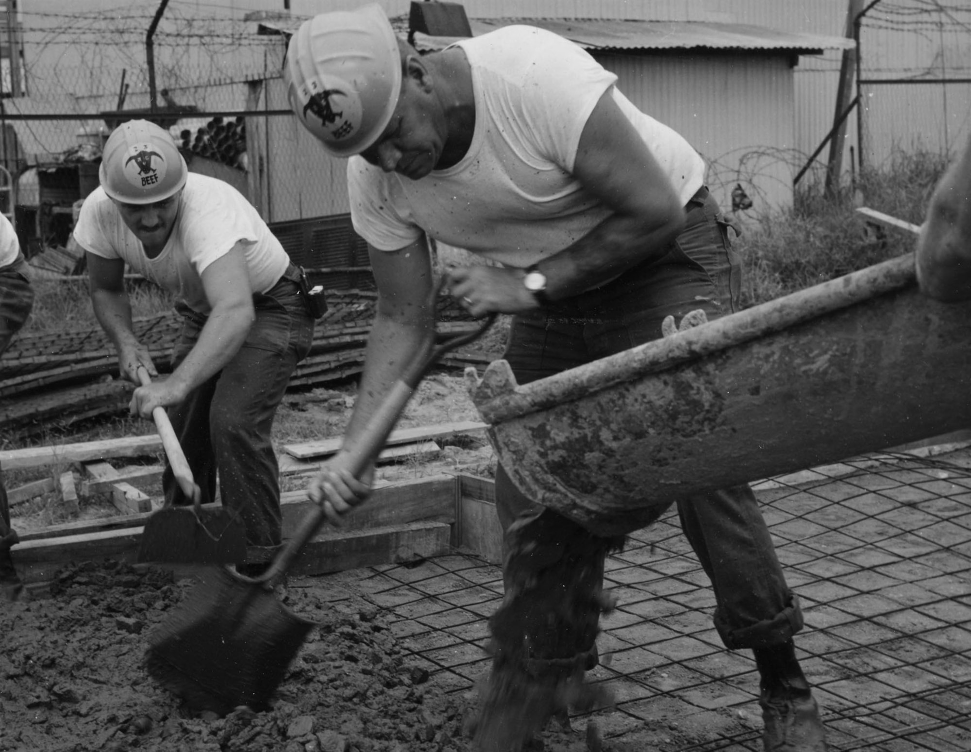 A Prime BEEF crew pours concrete for the floor of a building at Tan Son Nhut AB in South Vietnam. (U.S. Air Force photo)