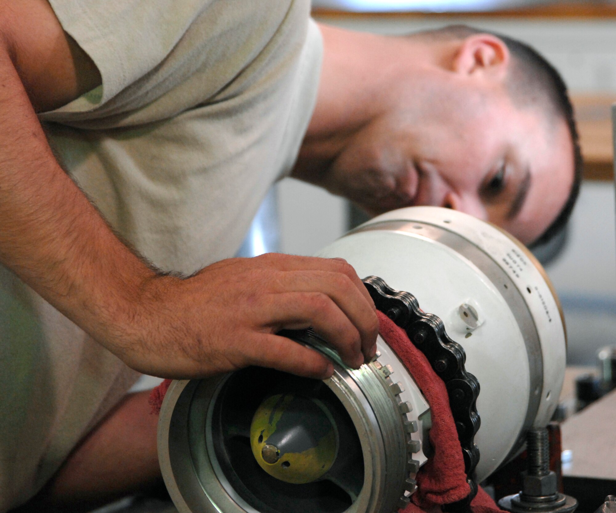 MCCONNELL AIR FORCE BASE, Kan. -- Staff Sgt. James Long, 22nd Maintenance Squadron, repairs a boom nozzle, June 26. The boom is instrumental to the KC-135 Stratotanker, is the primary means of fuel transfer in aerial refueling. (Photo by Senior Airman Laura Suttles)

